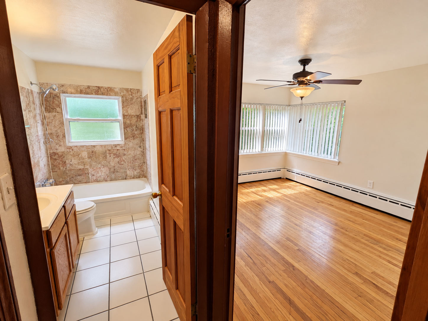 Bright Bathroom and Sunlit Bedroom Contrast.png