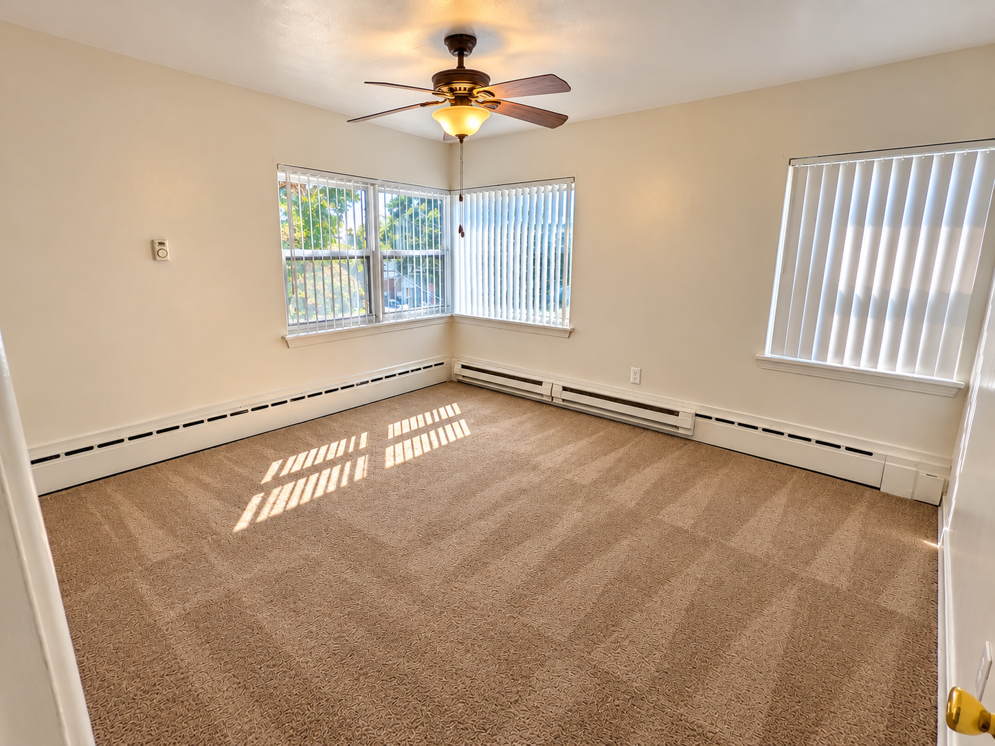 Bright Empty Room with Ceiling Fan.png