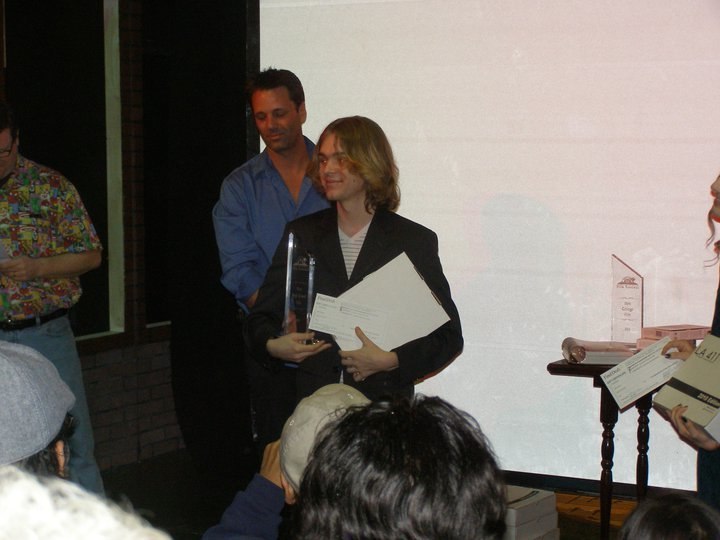 Michael Tanner Cusumano accepting an award for his film "Amanda"