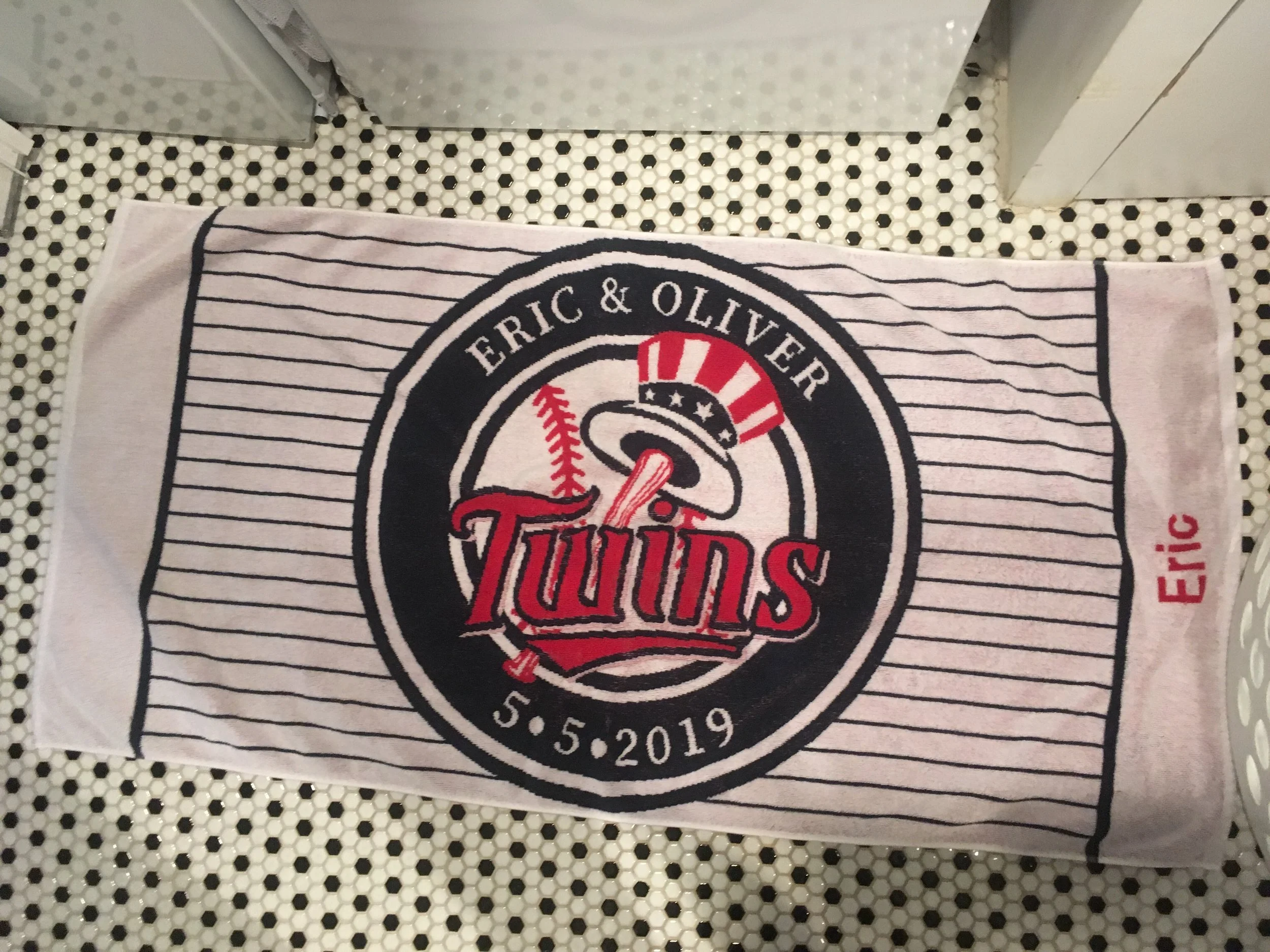 A towel given to guests at the party from the birthday boys who are both fans of the Yankees and also super fast swimmers!