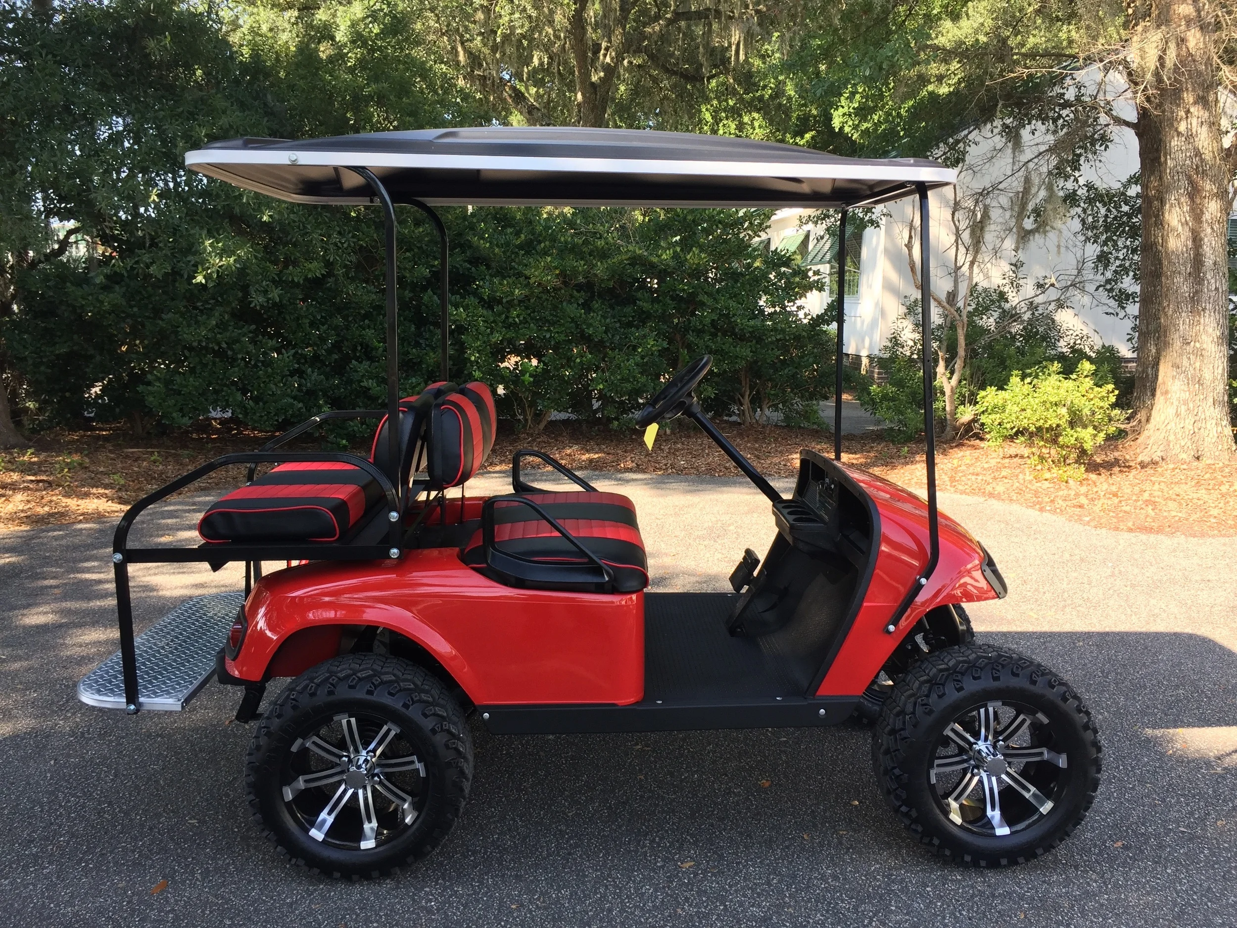 Red EZGO Lifted Cart Red/black seats, black extended top, new batteries, high speed code, LED lights, and Backlash (23x10x14) tires