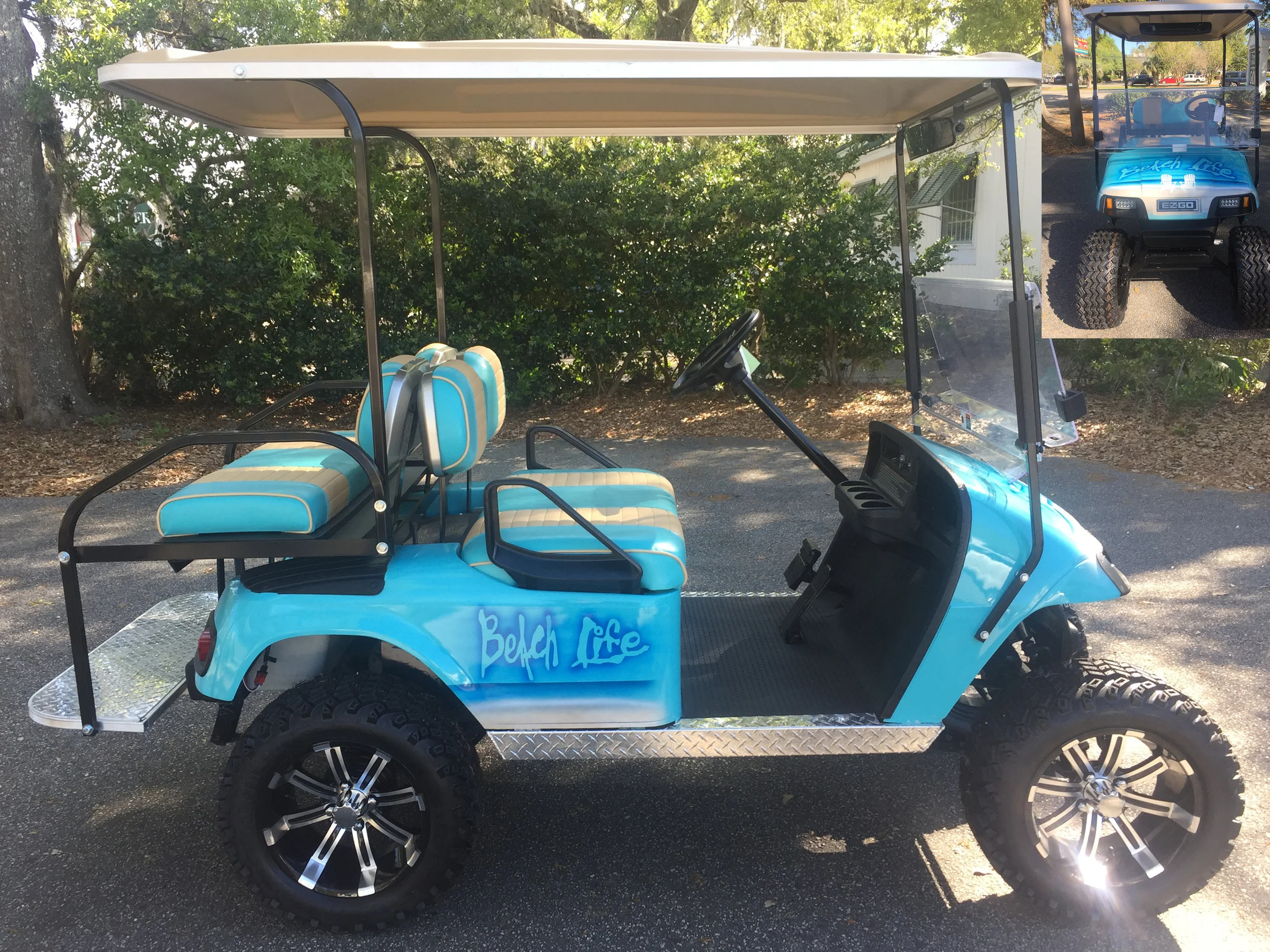 Aqua Beach Life EZGO Lifted Cart Aqua/tan seats, tan extended top, new batteries, high speed code, LED lights, Backlash (23x10x14) tires, mirror, flip windshield, and state of charge meter