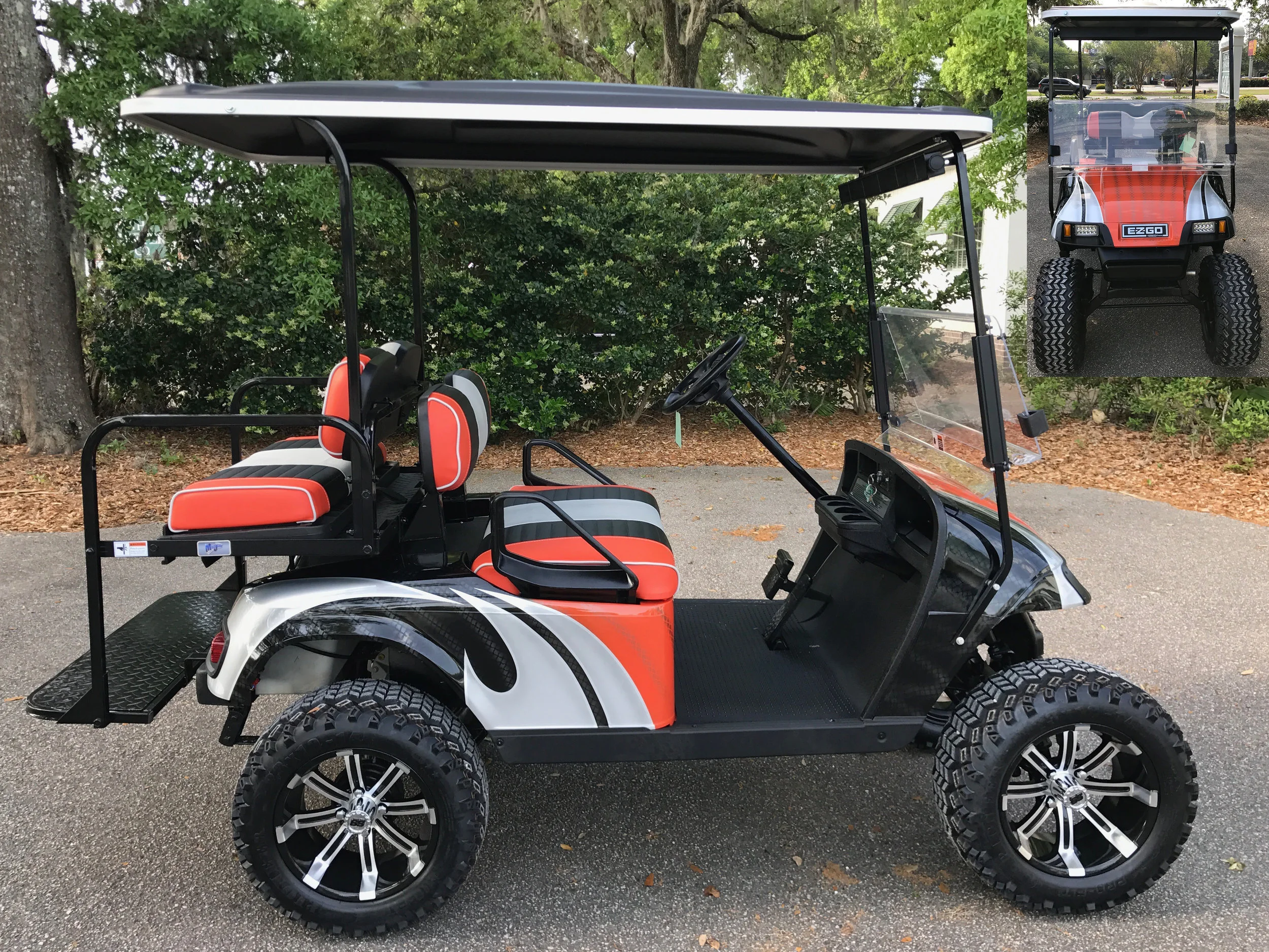 Orange Swirl EZGO Lifted Cart Orange/black/smoke seats, black extended top, new batteries, high speed code, LED lights, Backlash (23x10x14) tires, mirror, flip windshield, and state of charge meter