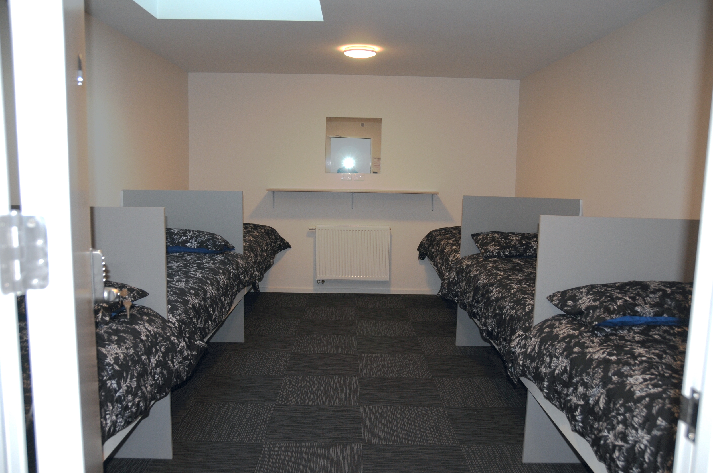 One of three six-bed rooms available in the facility
