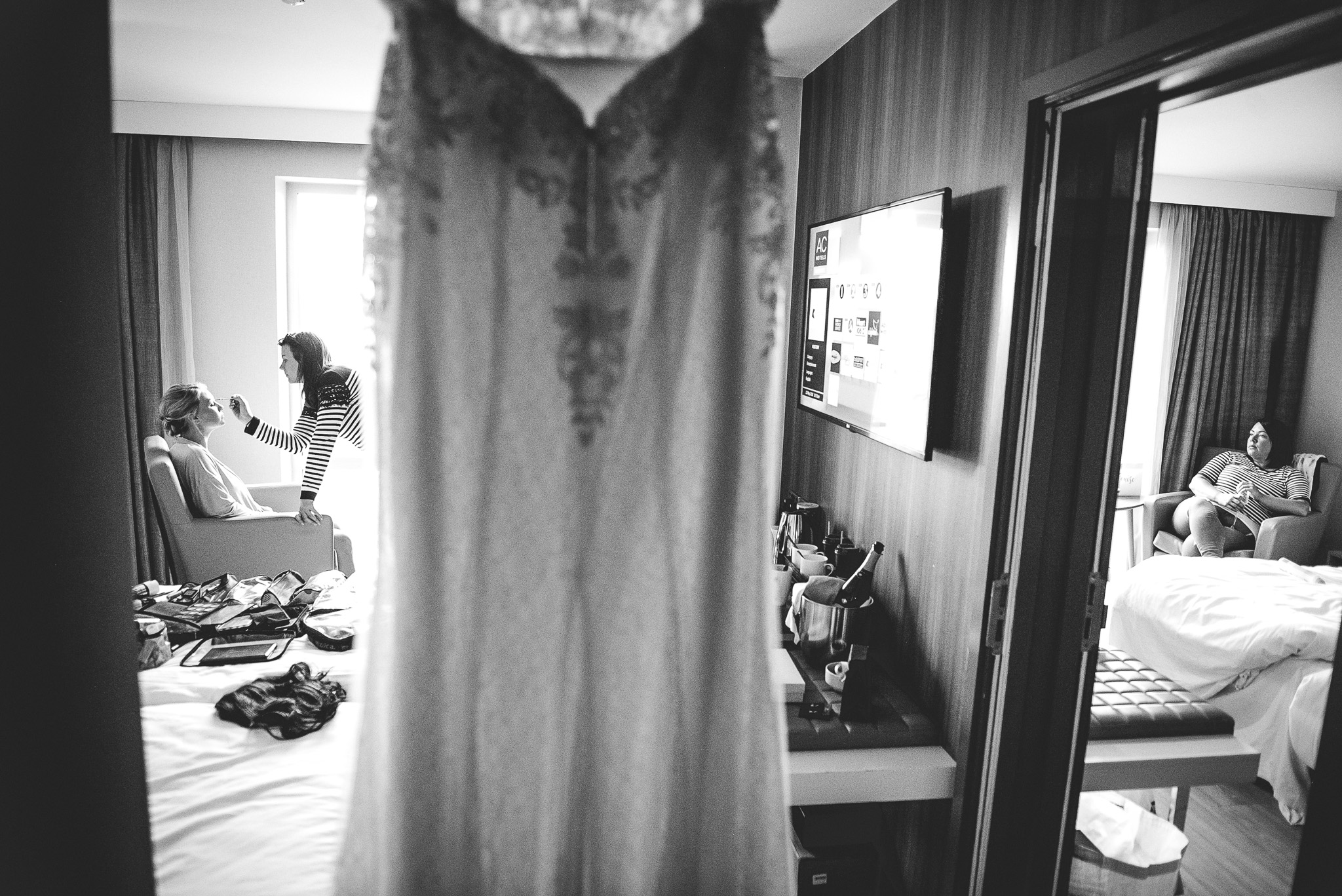 Bride getting ready while others wait
