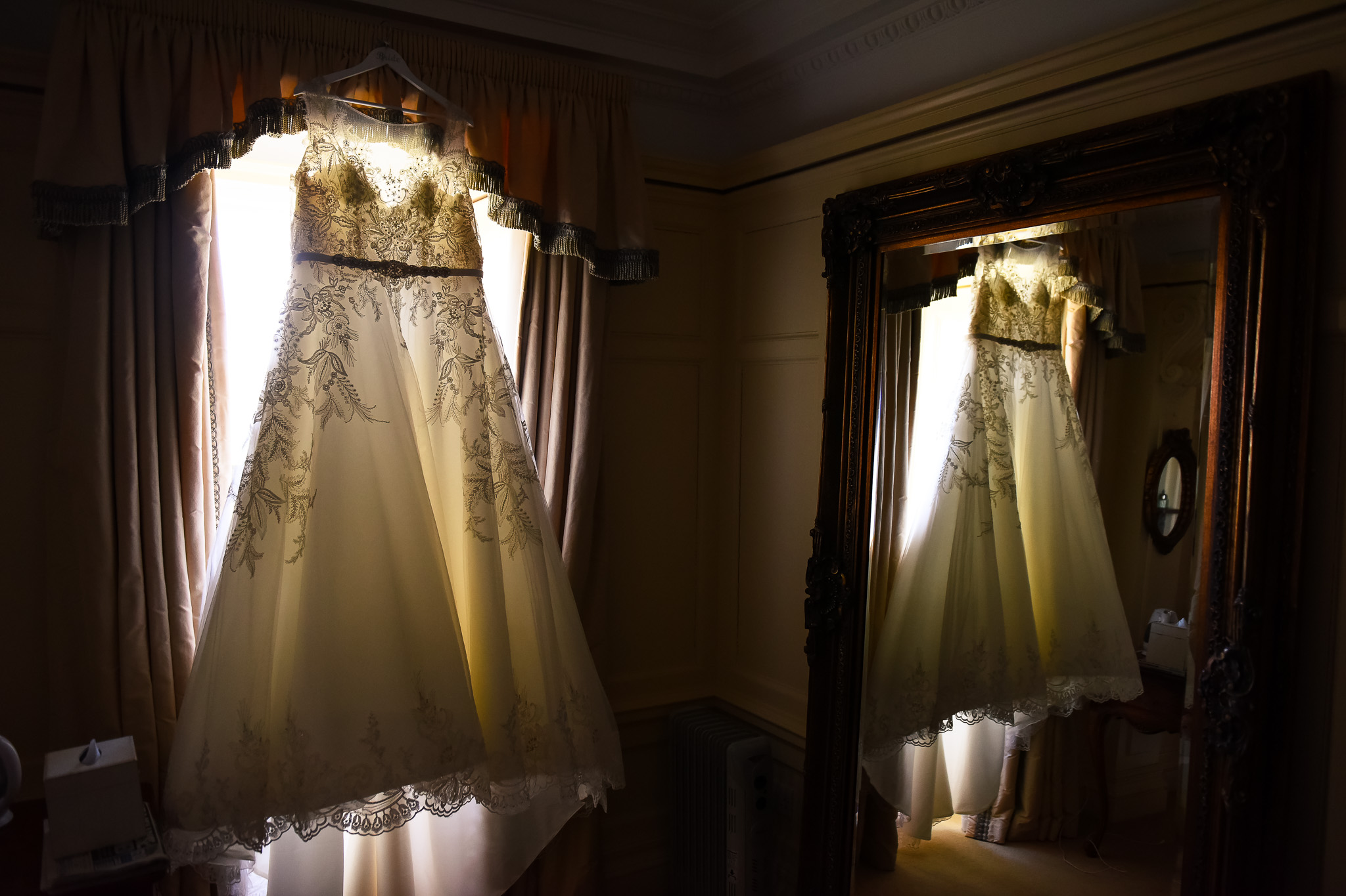 Reflection of wedding dress in mirror