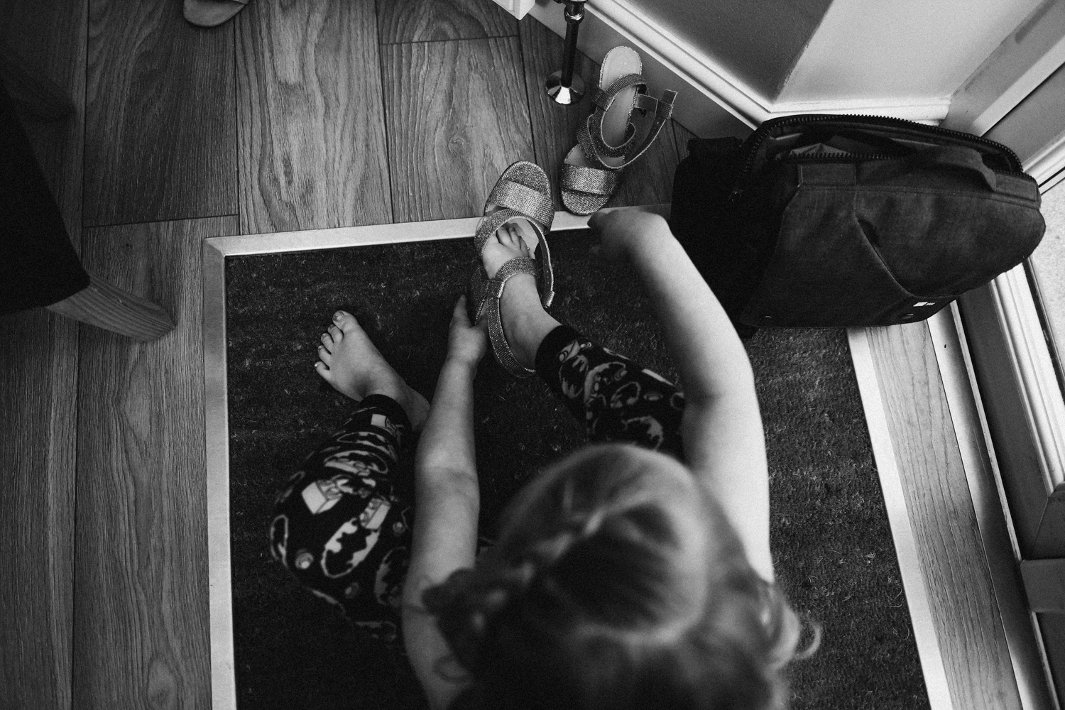 Flower girl trying on her shoes