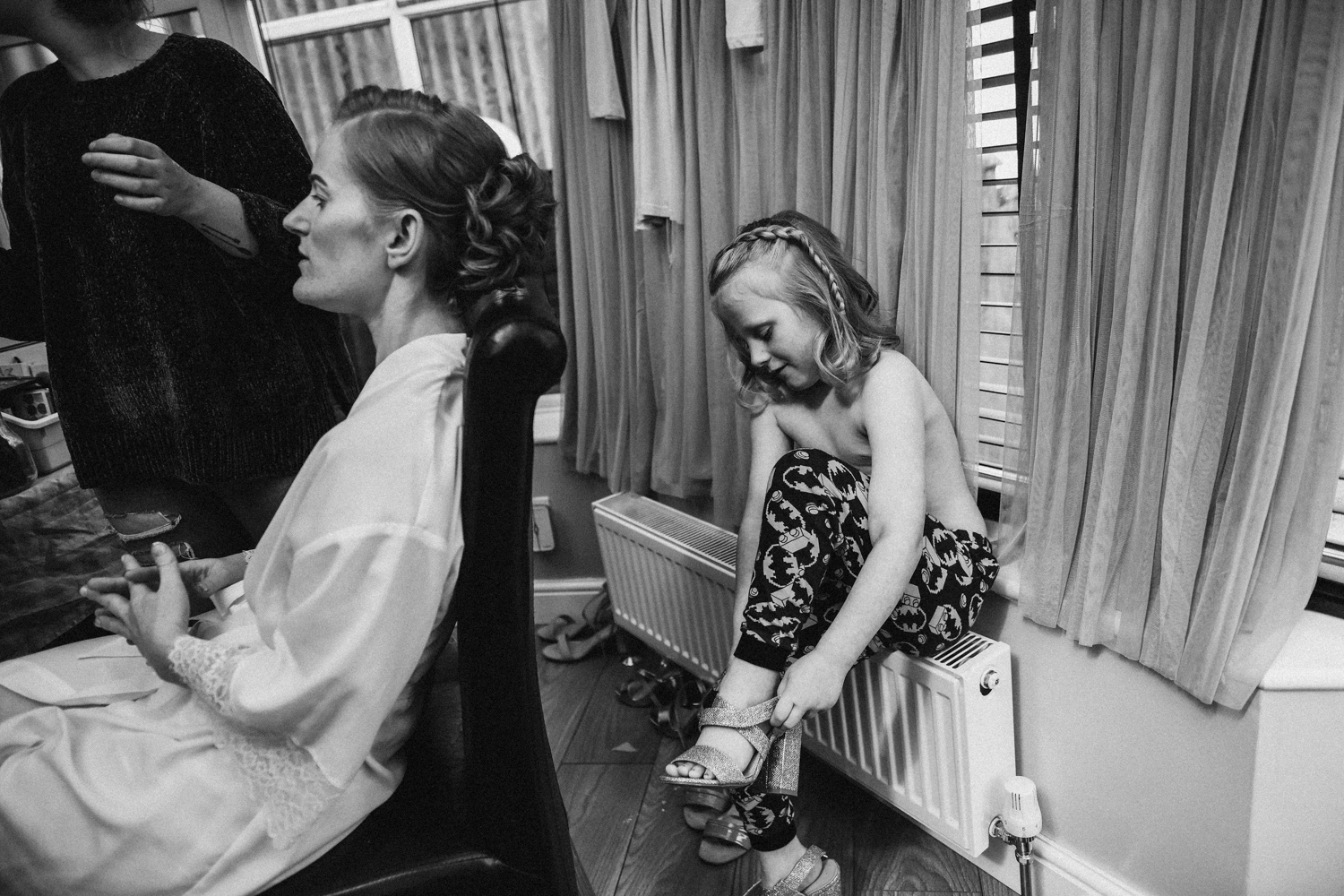 Flower girl and bride getting ready