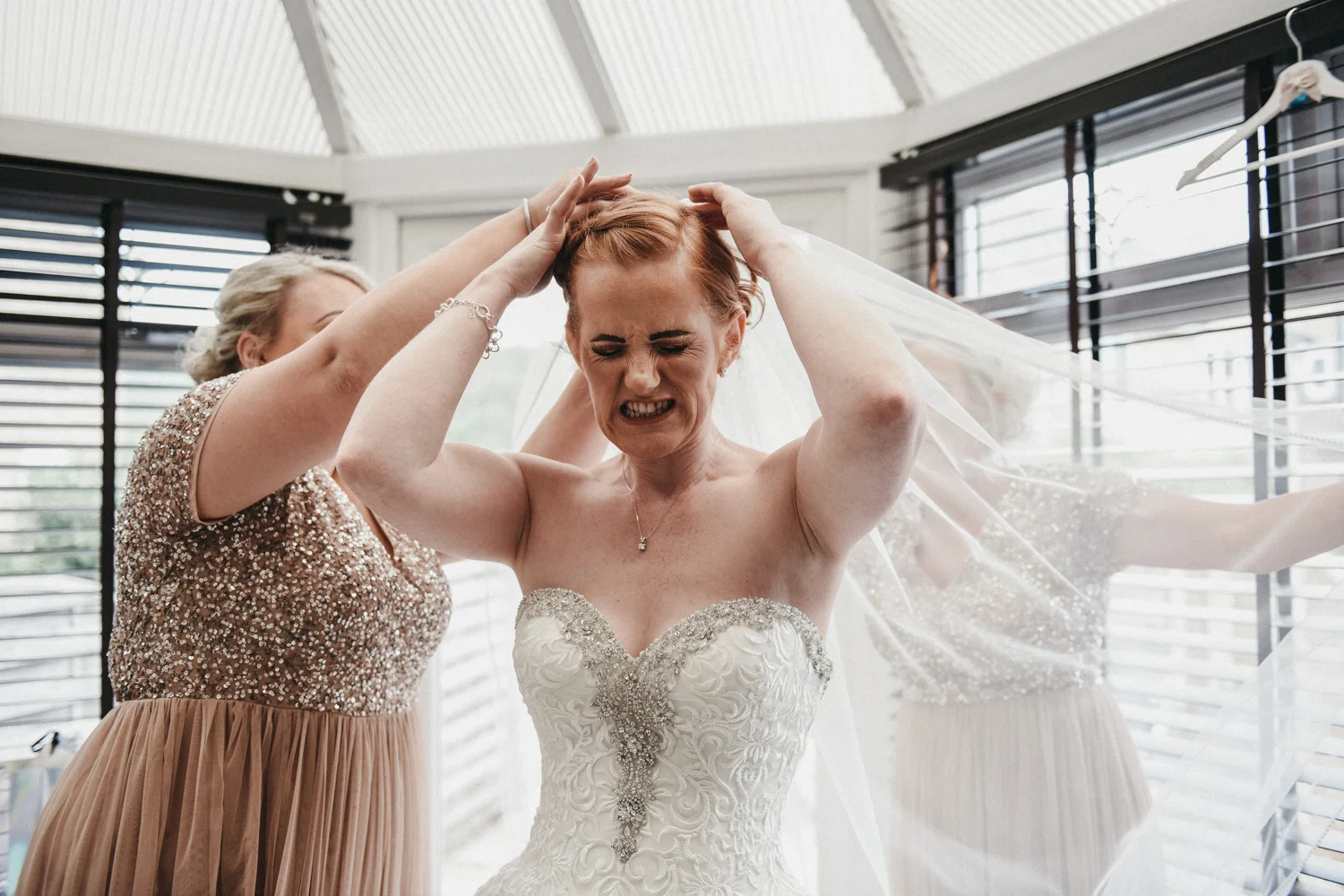 Bride attaching her veil