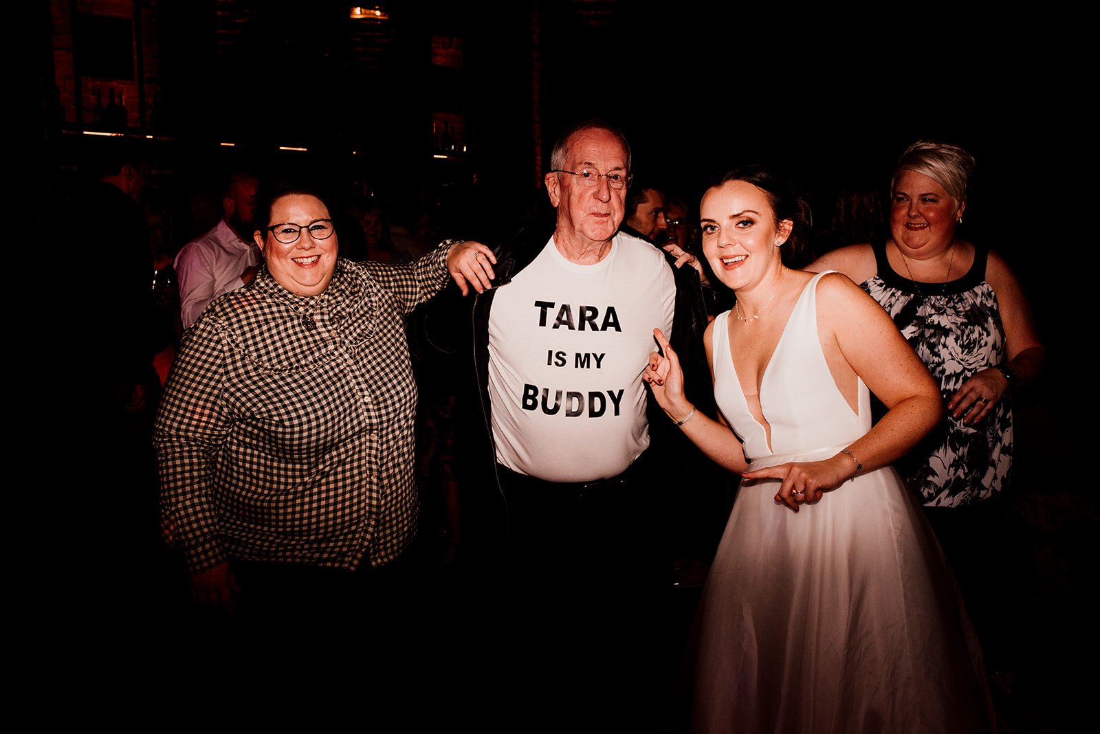 Bride posing with other Yorkshire wedding guests