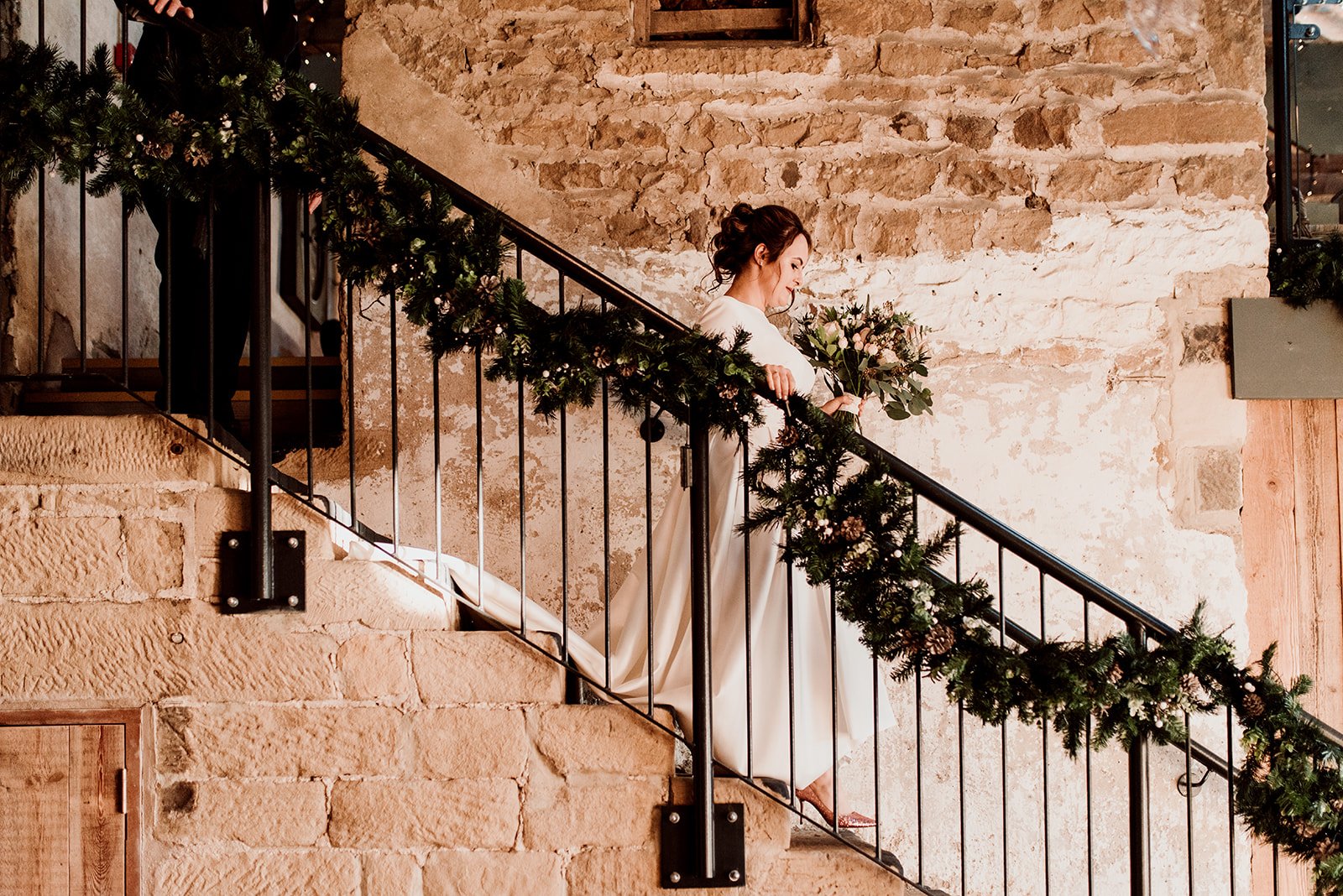 The bride walking down the steps at Wharfedale Grange