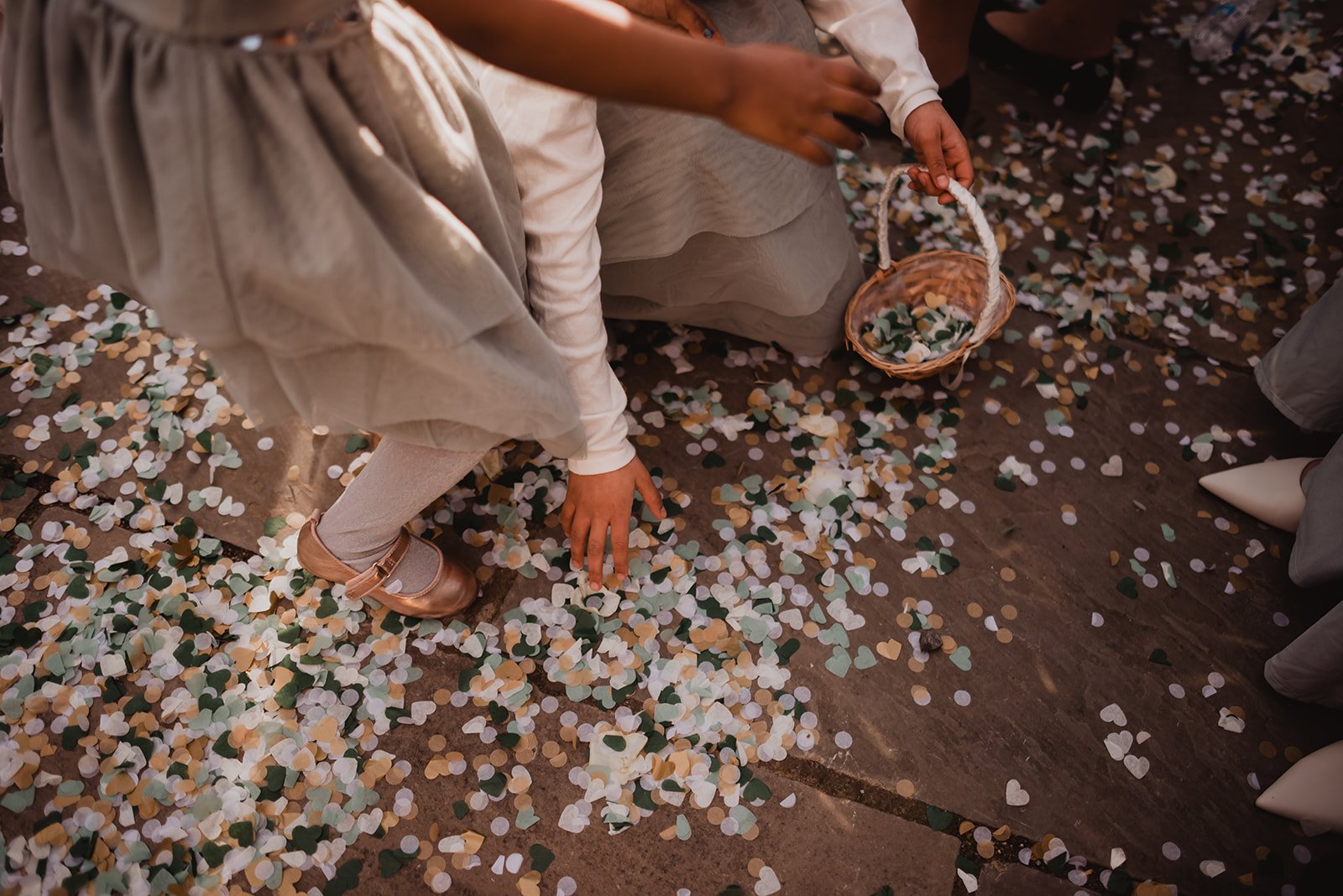 Young girl collecting confetti