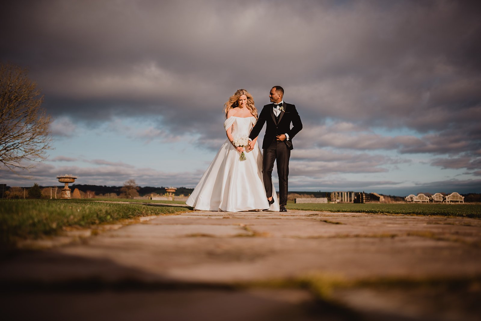 Bride and groom with a blue sky backdrop