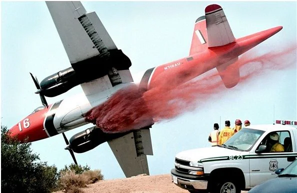 Plane dropping foam (Image via wildforestfires.com)