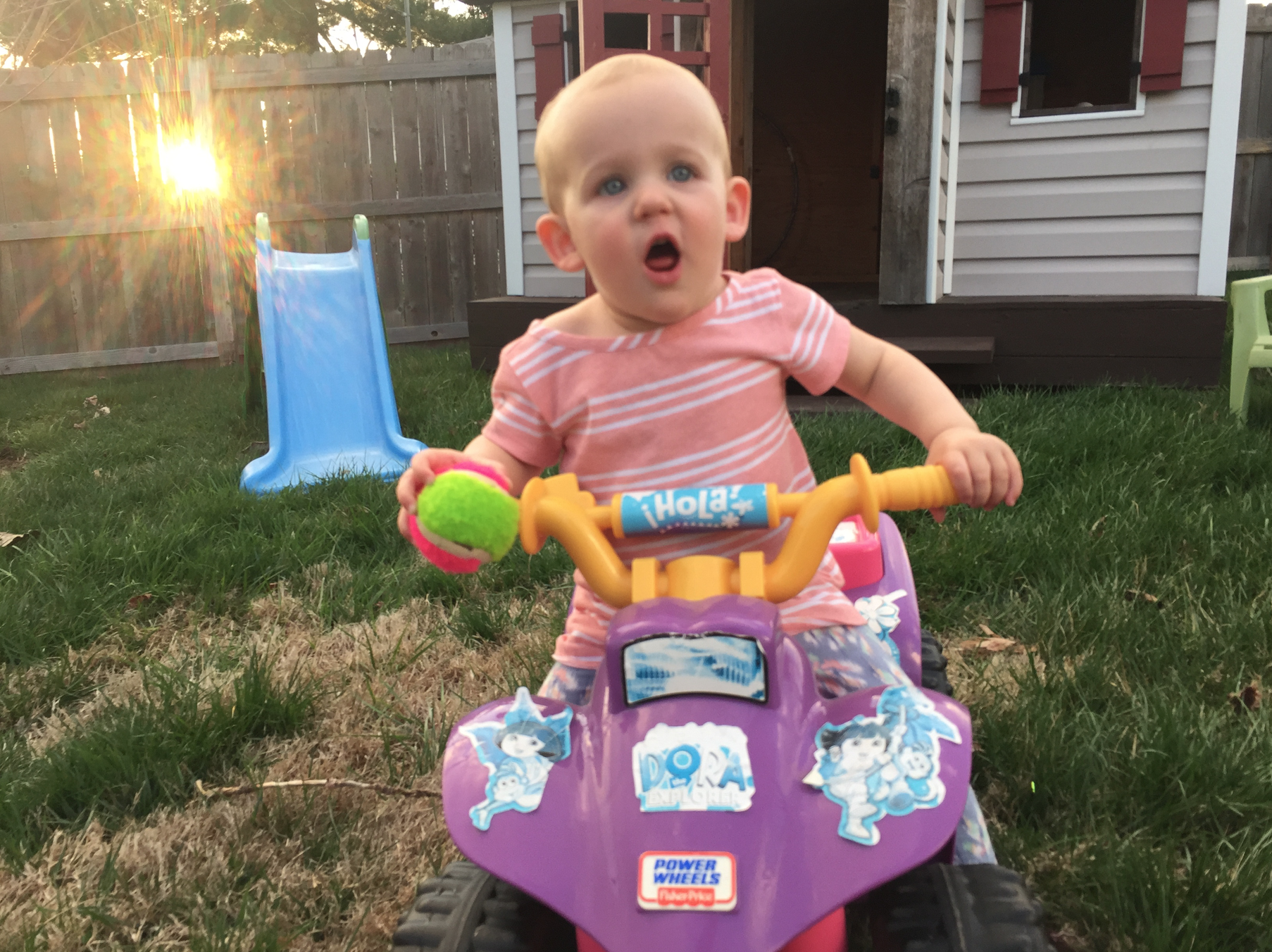 Celine playing in our back yard.png