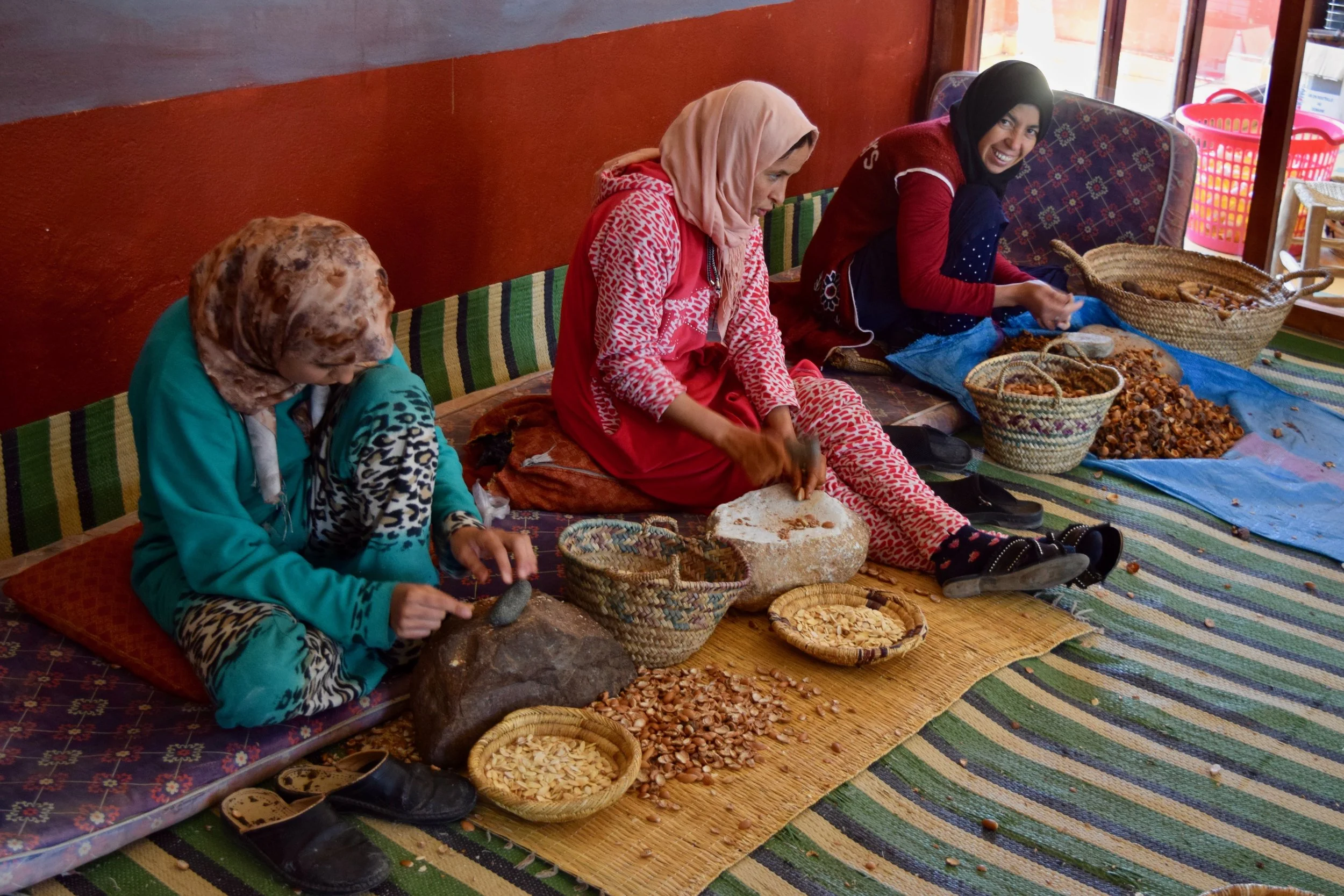 Berber women making argan oil