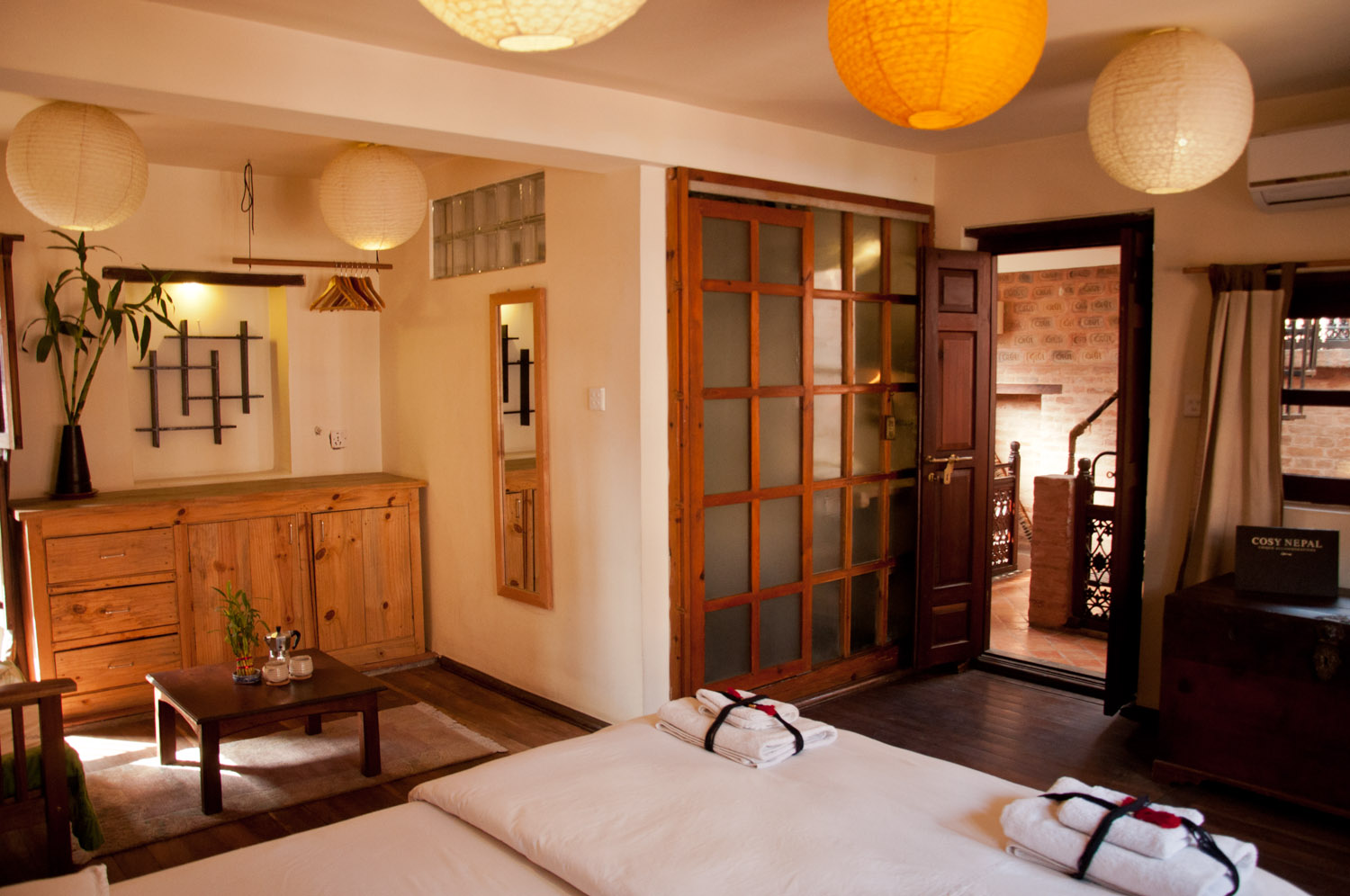 From the bed's corner: storage space, sitting space, bathroom with modern shower and direct access to the beautiful roof terrace.
