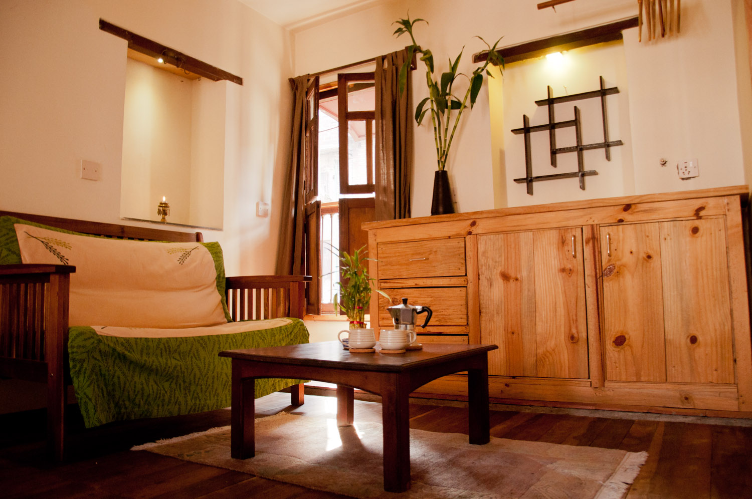 Comfortable sitting/storage space at the right corner part of the bedroom.