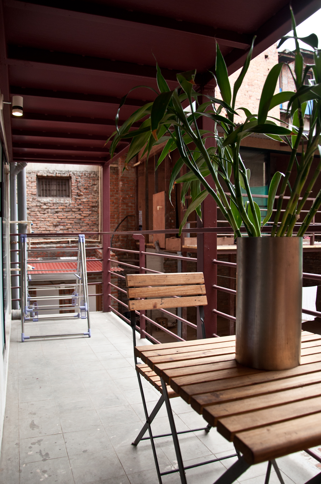 Bedroom's balcony with coffee table and drying space for laundry