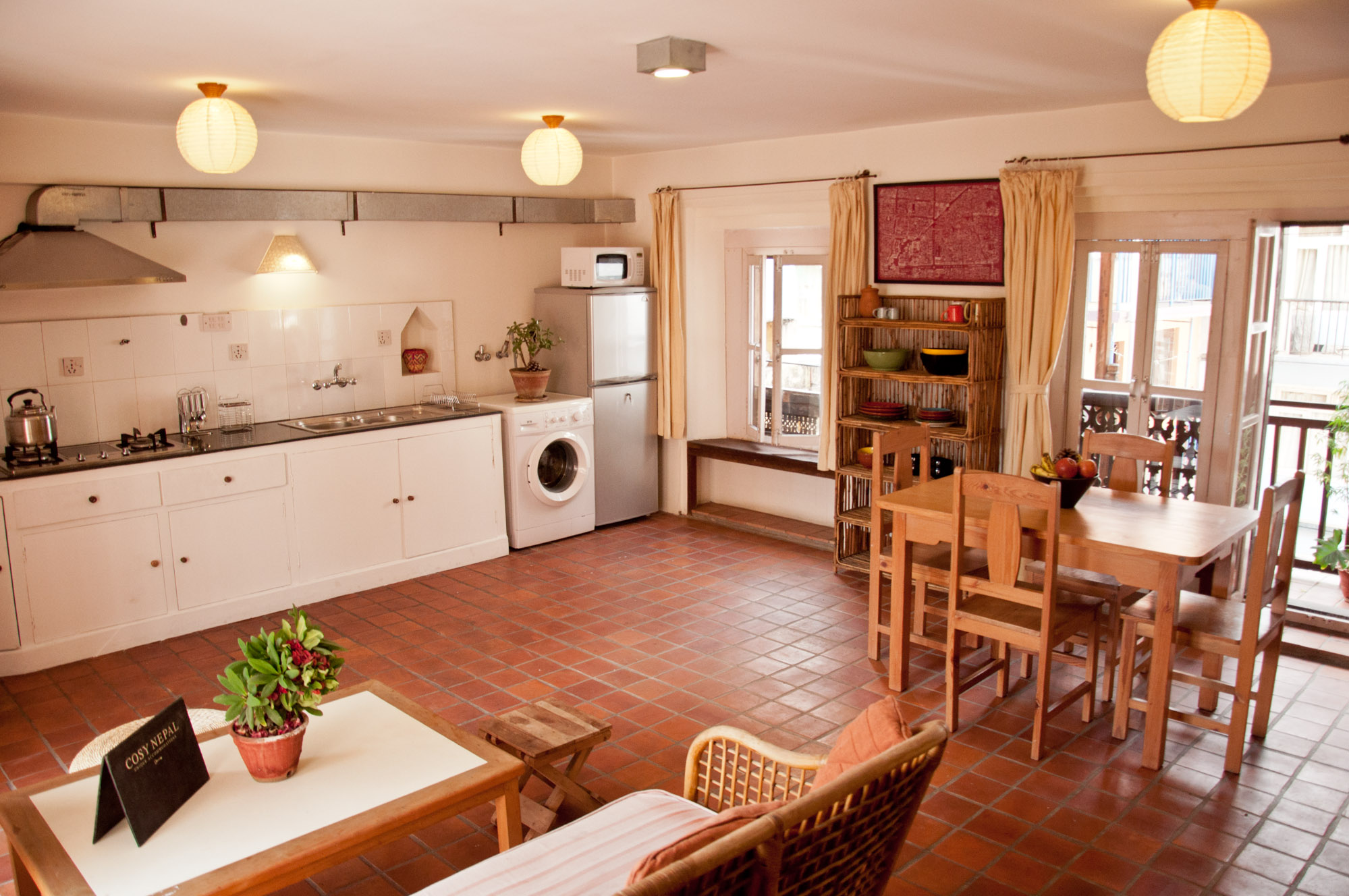 Living room/ kitchen with sofa and dining table