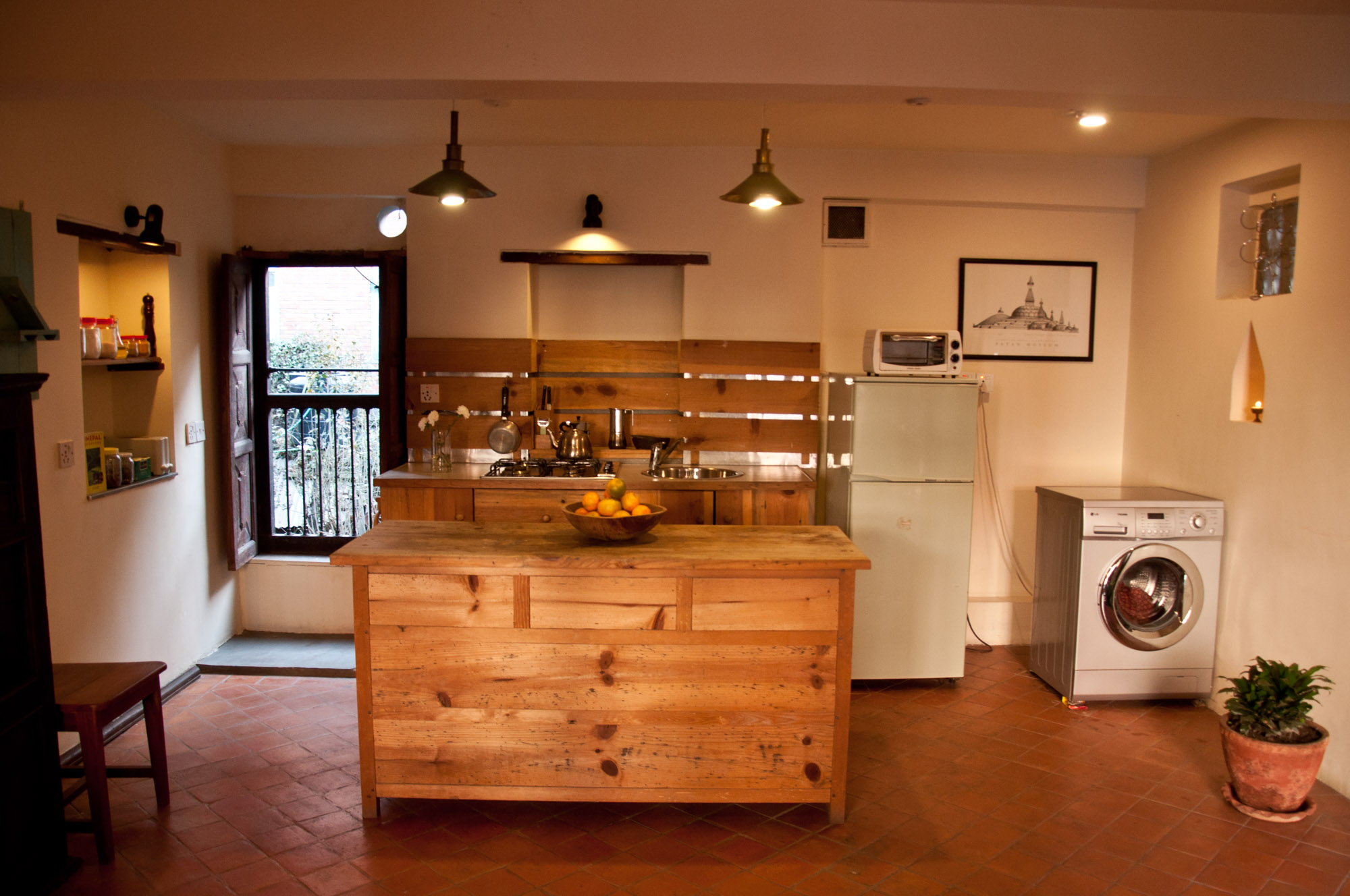 well equipped kitchen with pots and pans