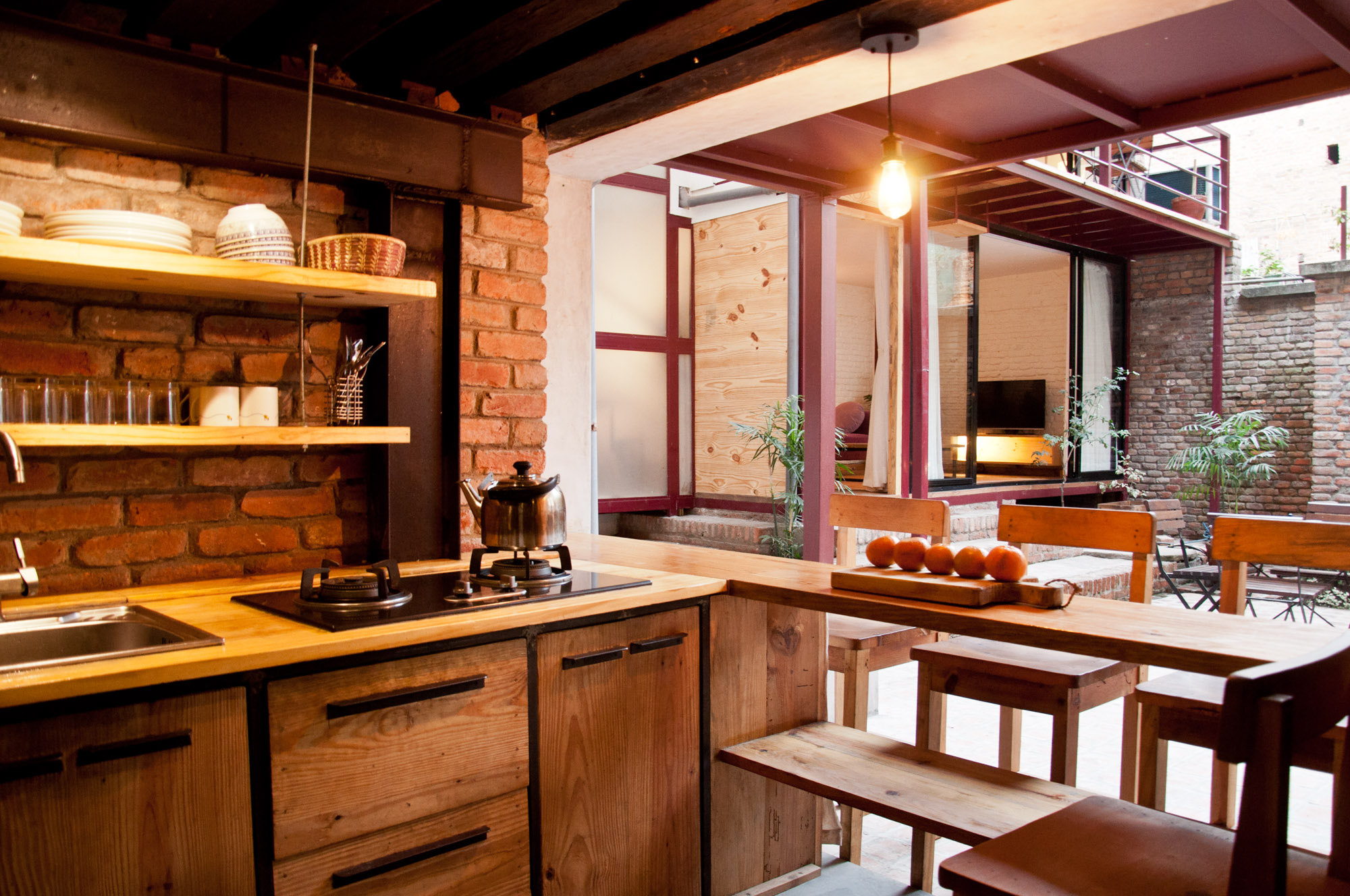  there is well equipped kitchen inside the premises of courtyard cottage. 