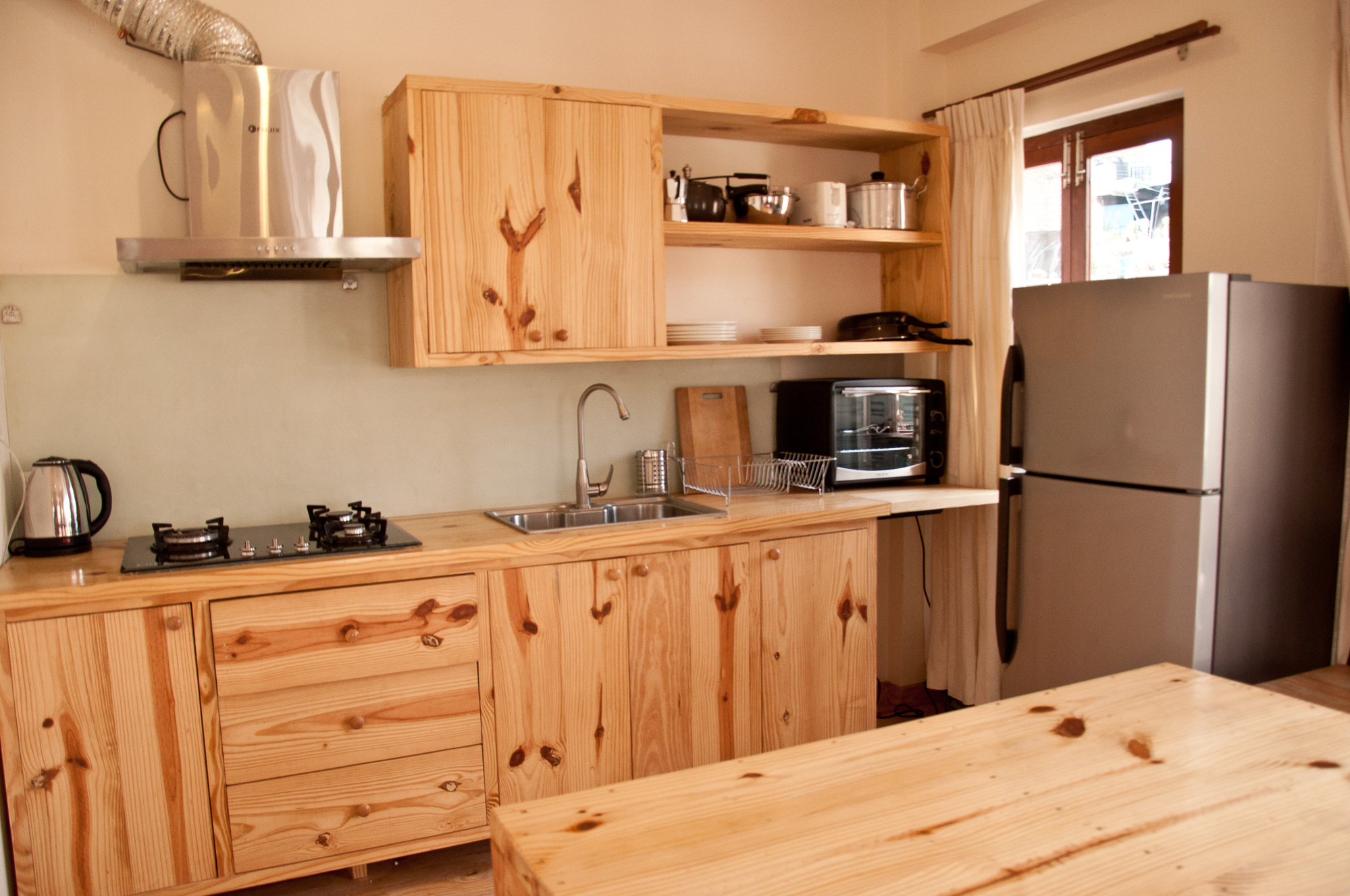 Well equipped Kitchen with oven, pots and pans, fridge , boiler and more.