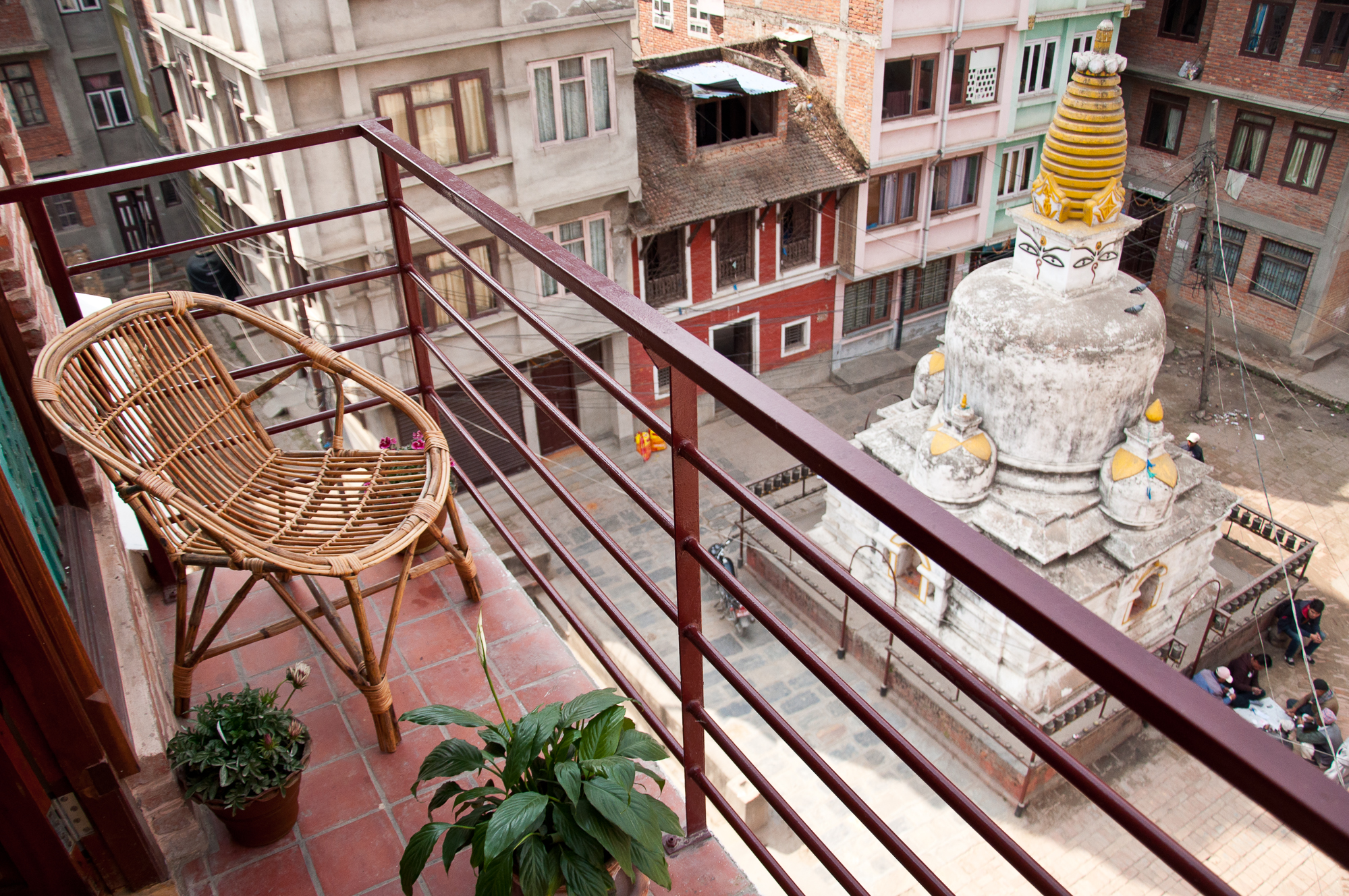 Small balcony on the kitchen side with a view over a beautiful ancient Stupa.