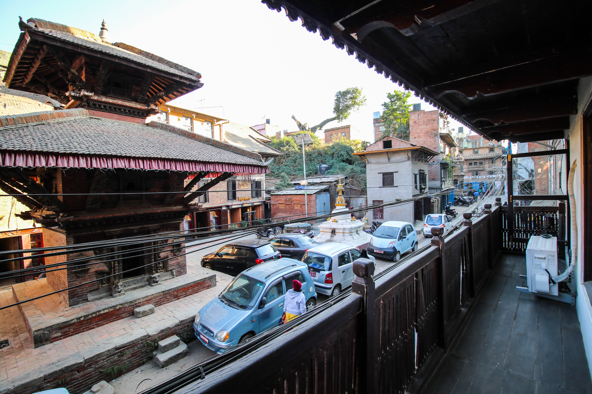 Street outside the balcony house and a small pagoda style temple.