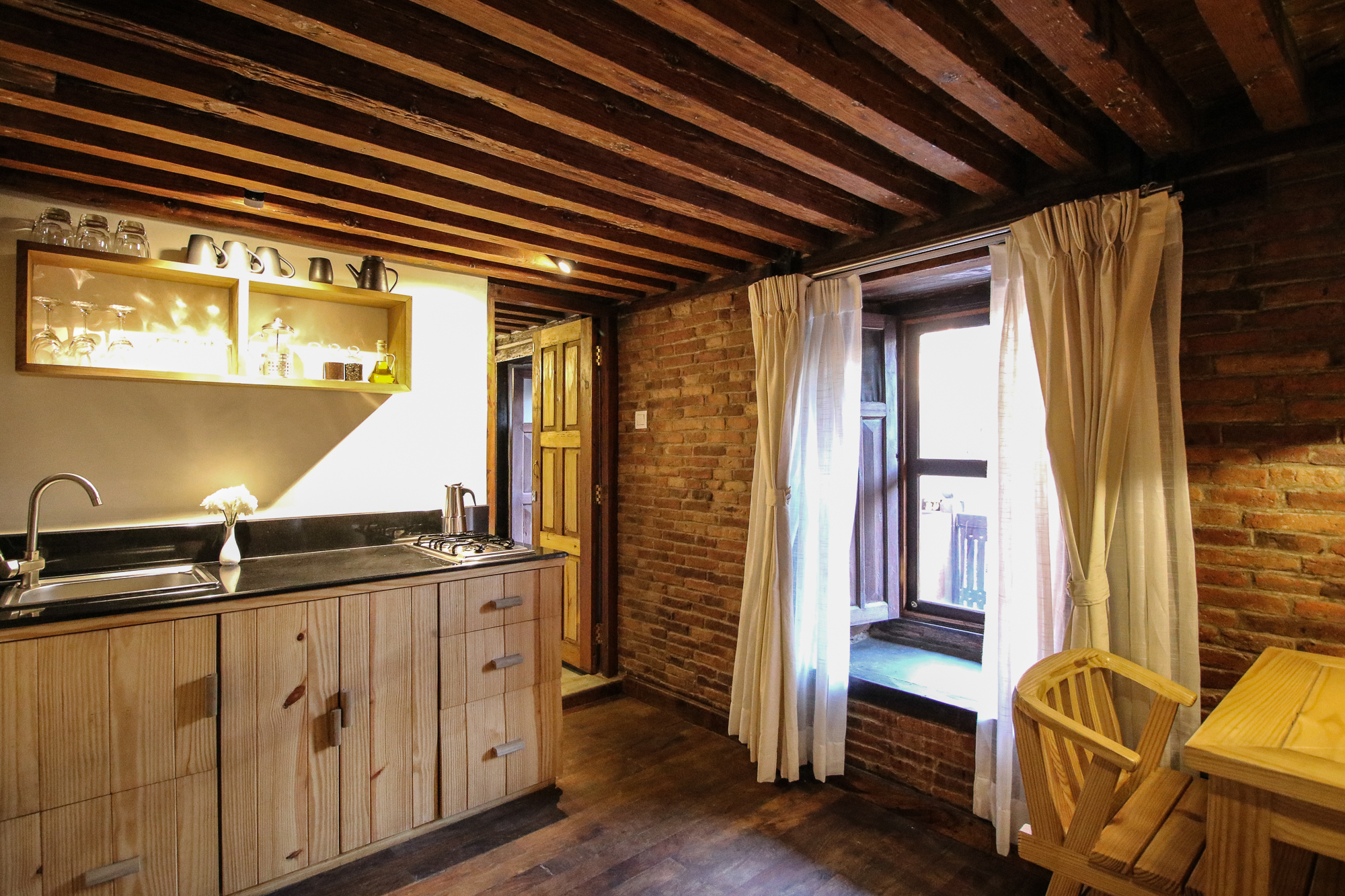 Fully equipped Kitchen and on the right entrance to the balcony outside.