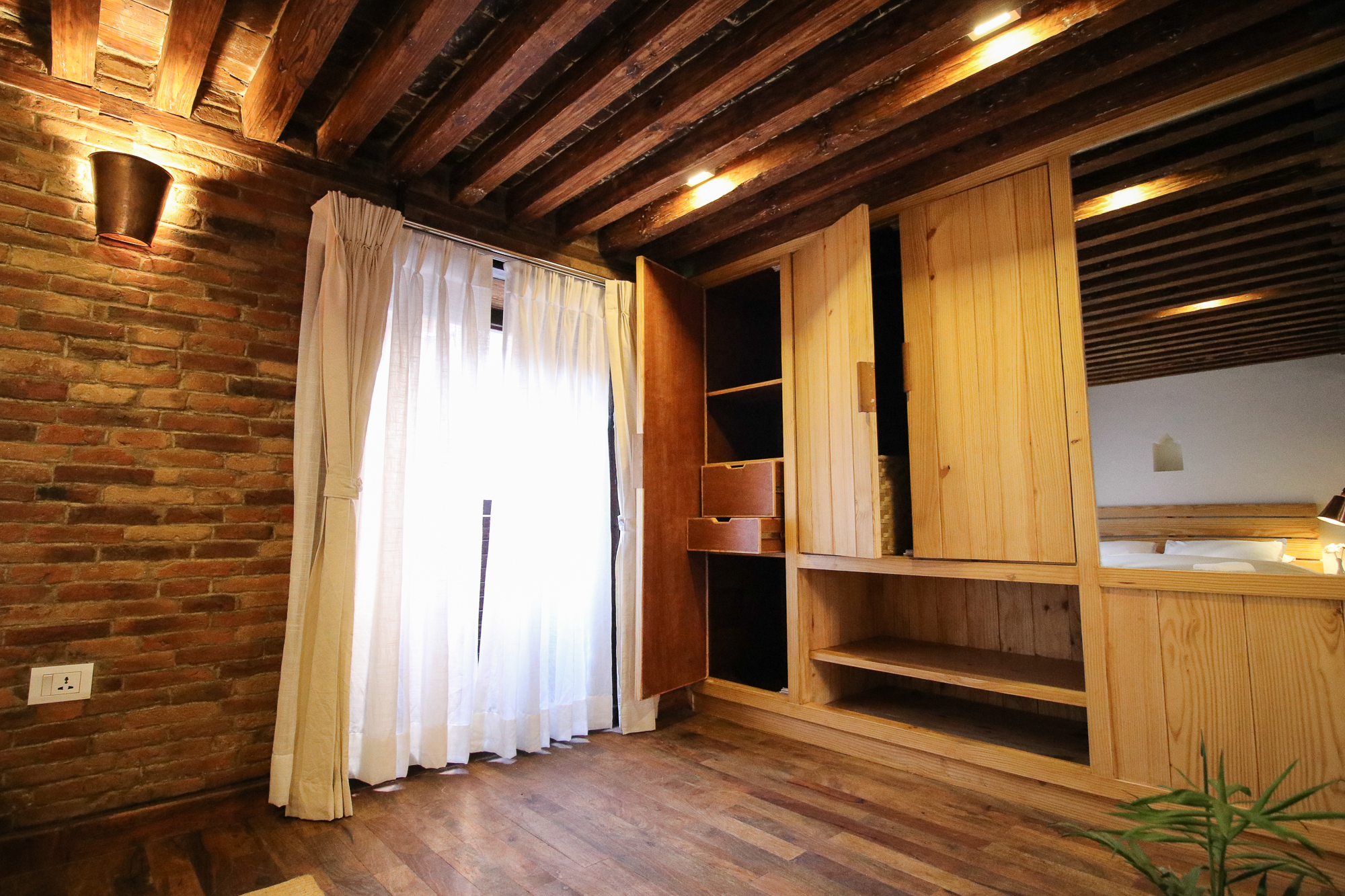 Cupboard to store clothes and on the left window to view back courtyard.