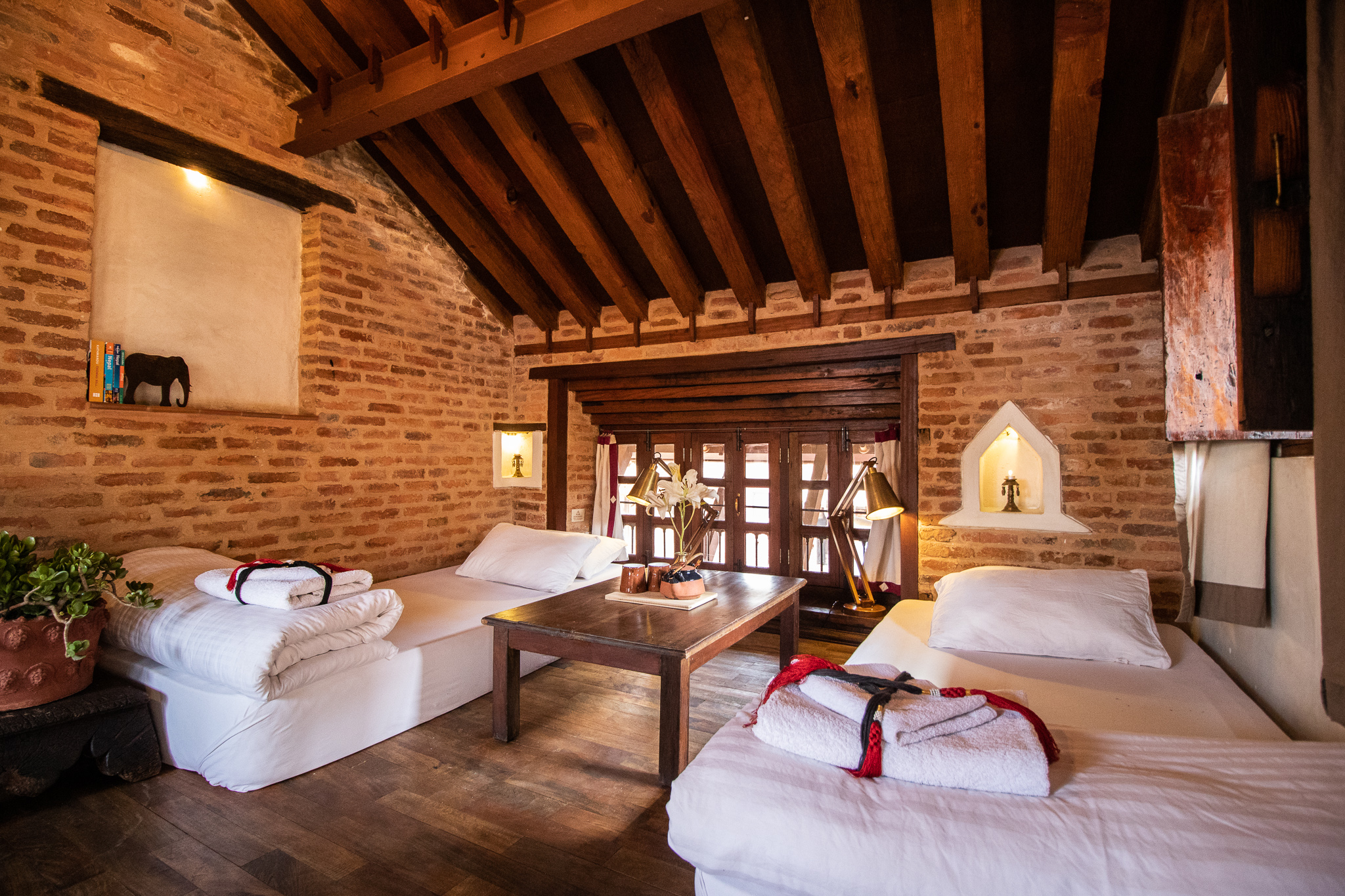 One of the unique feature of Newari architecture is it’s slighted roof top, you will notice the appropriate use of modern elements blended with traditional wooden beams.