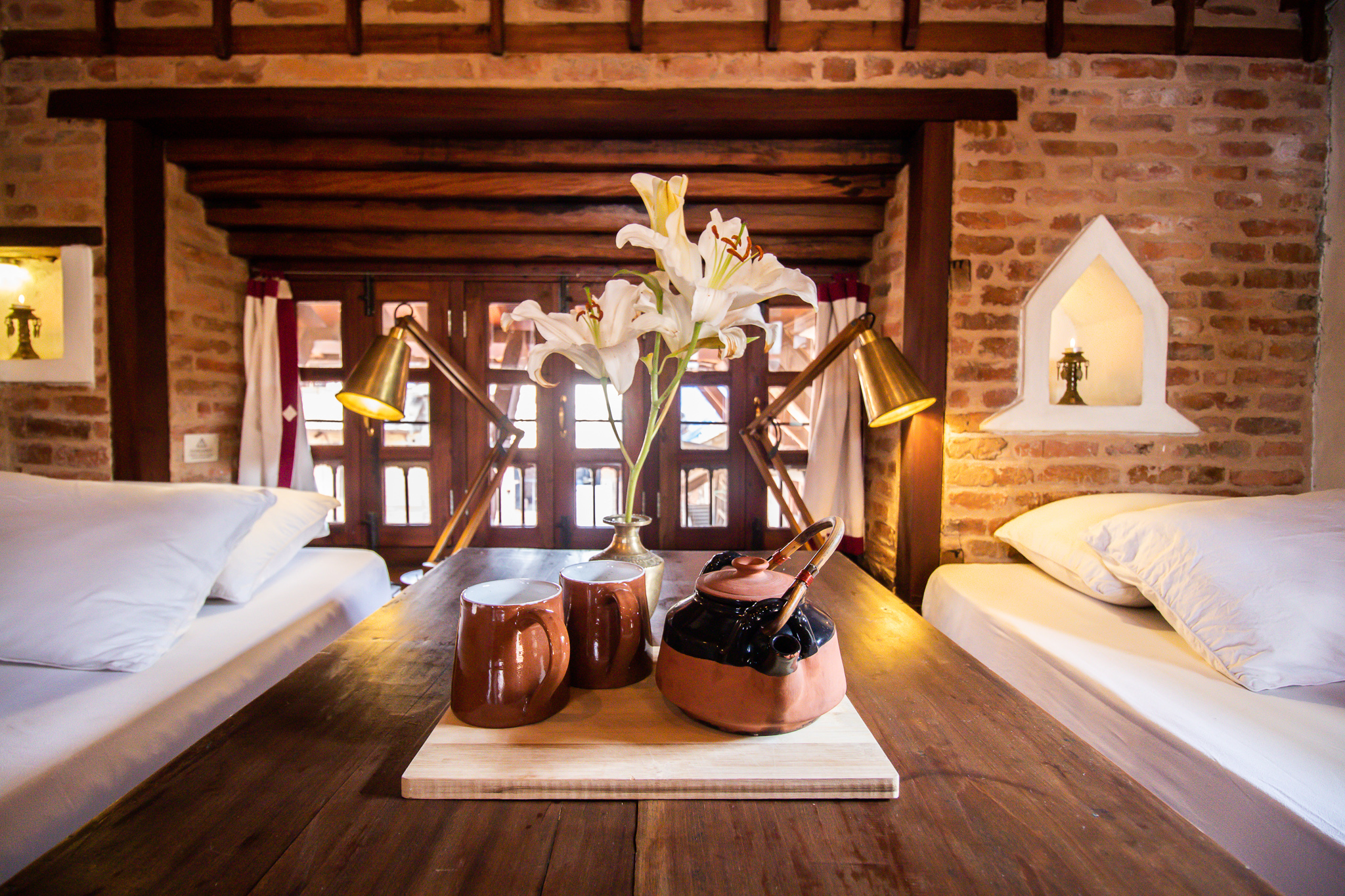 Bed sides lamps used in our rooms are quite special, they are hand made products from metalwood.