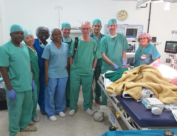 The surgery team from MEAK with Solomon prior to surgery to correct his heart valve. Dr. James Wong is 3rd from the right.