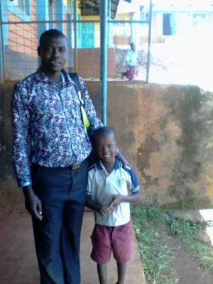 Amos Leperes, TKP's Student Health Officer and Solomon in March 2017.