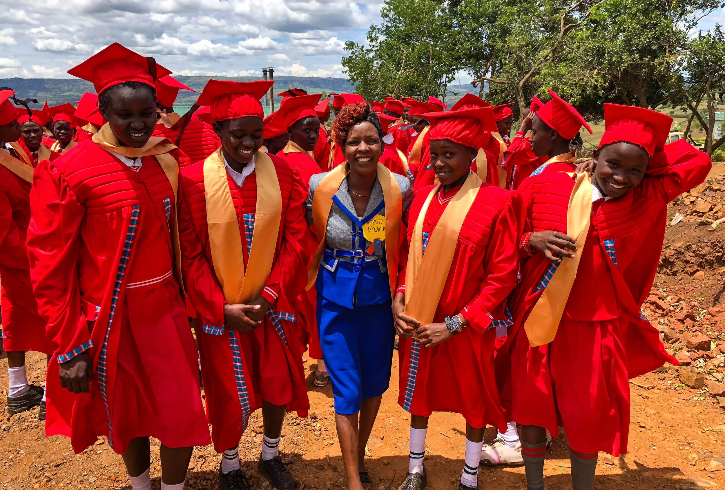 Students and teachers gather to celebrate the new graduates.