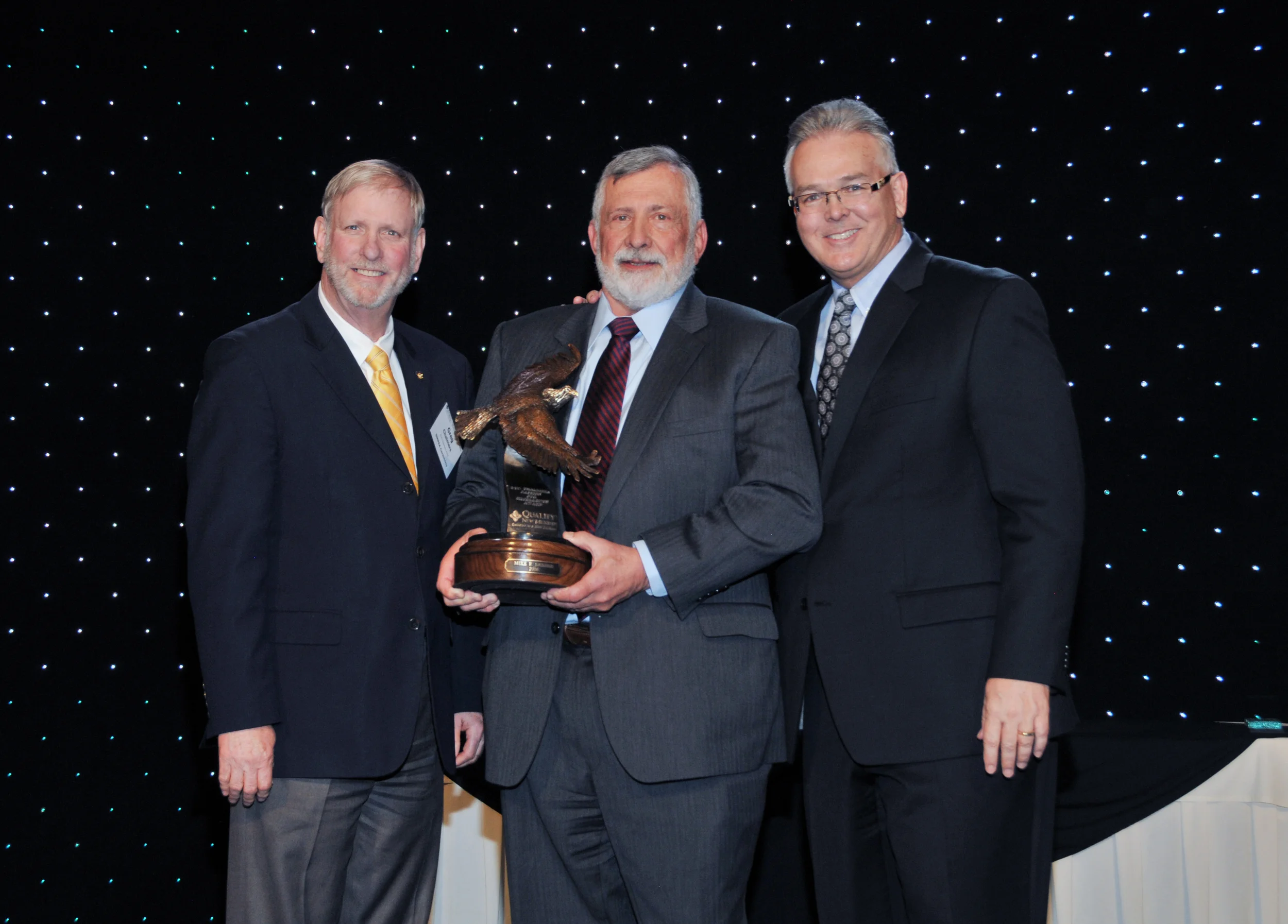 2016 - The recipient of the first Don Chalmers Passion for Excellence Award was Dr. Mike Sather, Center Director Emeritus, VA Cooperative Studies Program Clinical Research Pharmacy Coordinating Center in Albuquerque (center). The Award was presented by Greg Chalmers, brother of the late Don Chalmers (left) and Steve Keene (right), Managing Partner of Moss Adams, LLP and 2015-16 Board Chair.