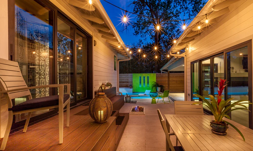 With a small backyard, the homeowners knew they were limited in space for outdoor living. But they made the space between two wings of the house work for a small patio that includes room for quite a bit of seating as well as a built in fire pit.