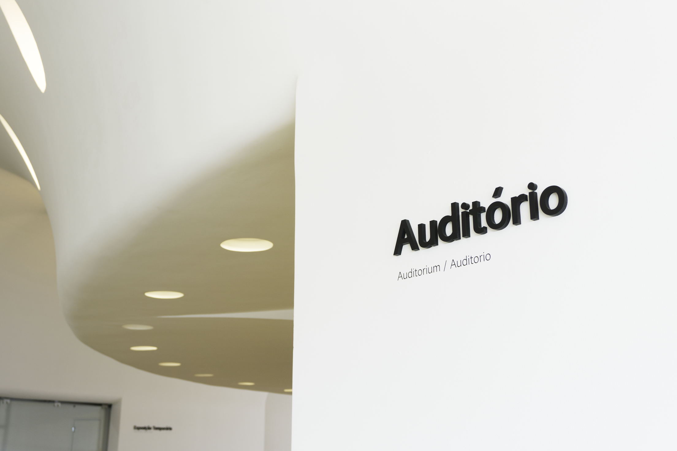  Applied signage onto building's concrete curved wall. 