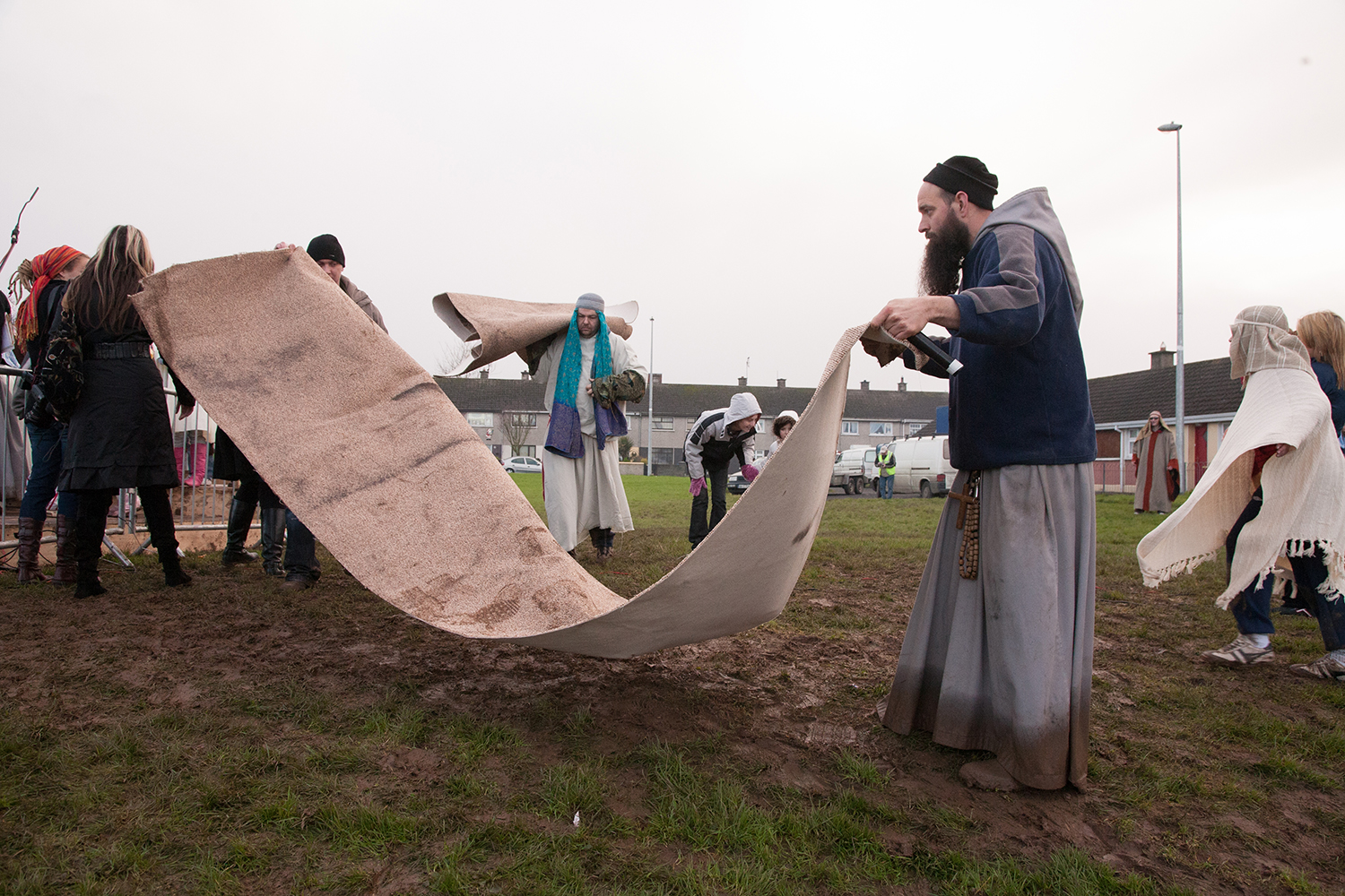 A documentary photograph of monk helping prepare a live nativity scene in Moyross, Limerick, Ireland