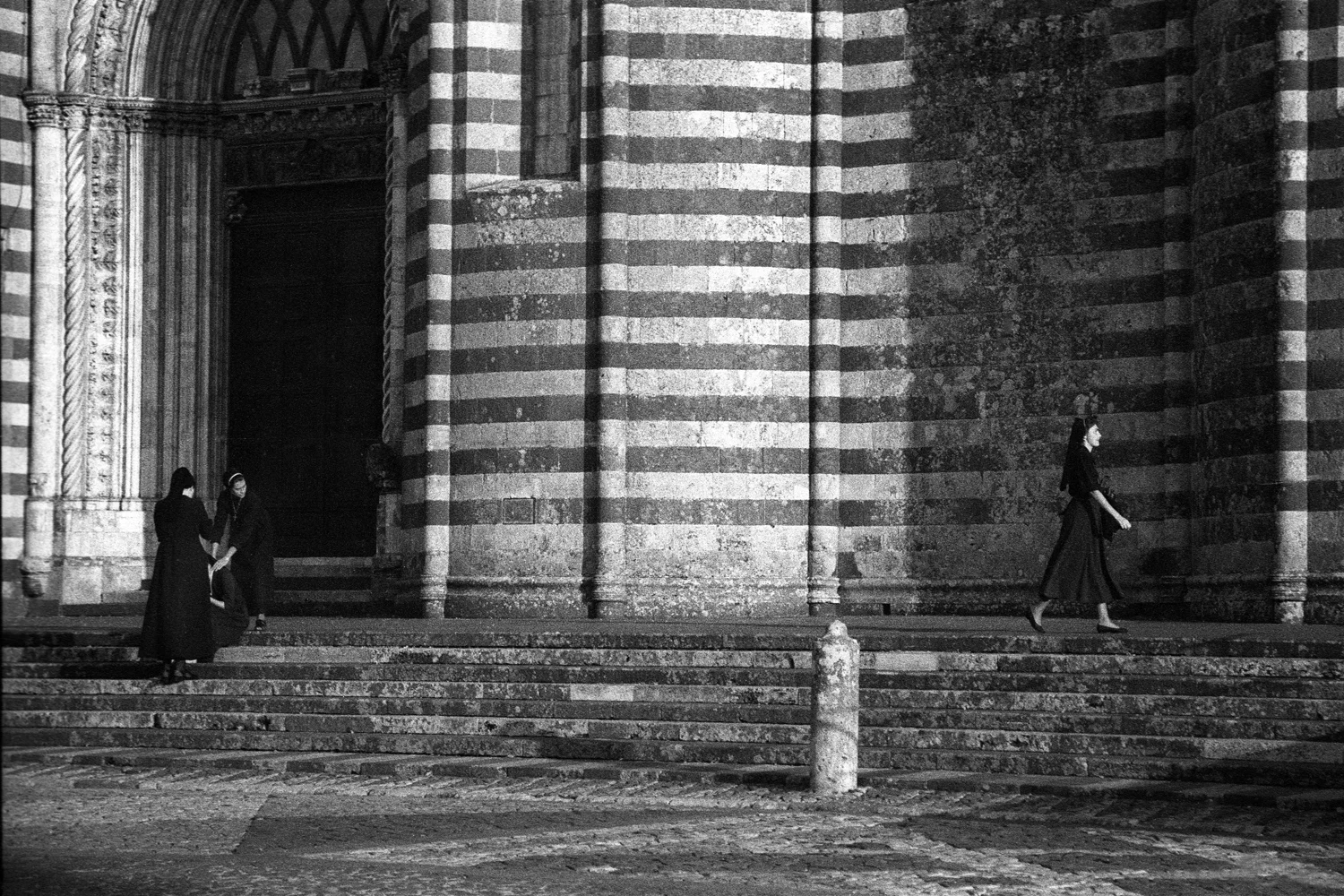 A documentary photograph of nuns in Italy