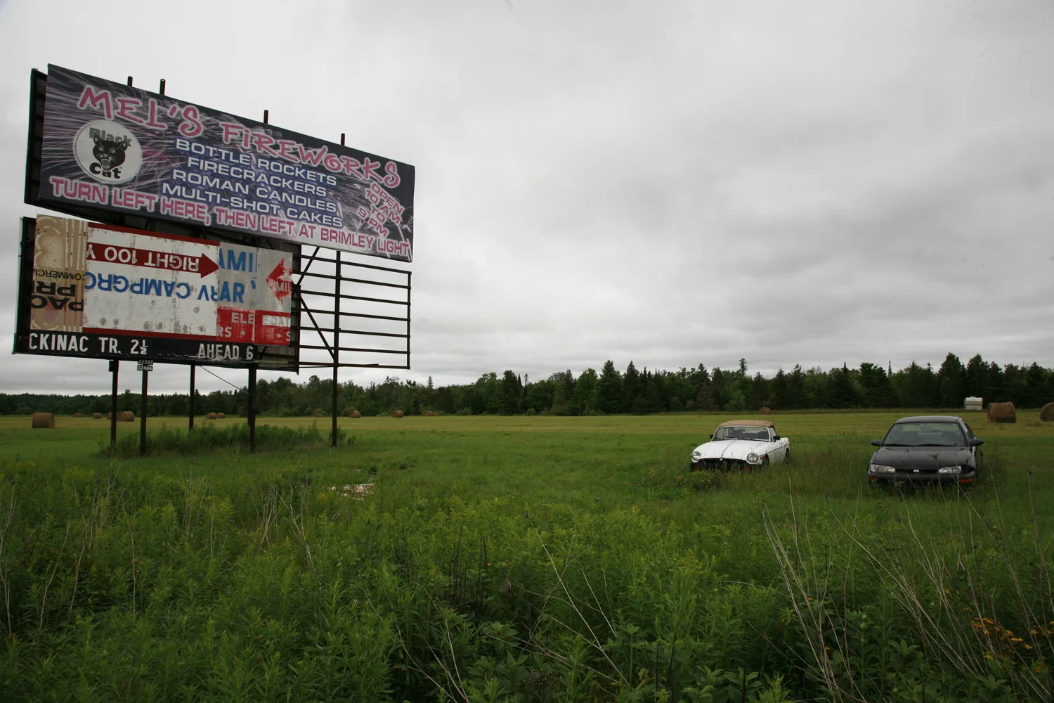A documentary photograph of a billboard advertising fireworks in the midwest of the united states