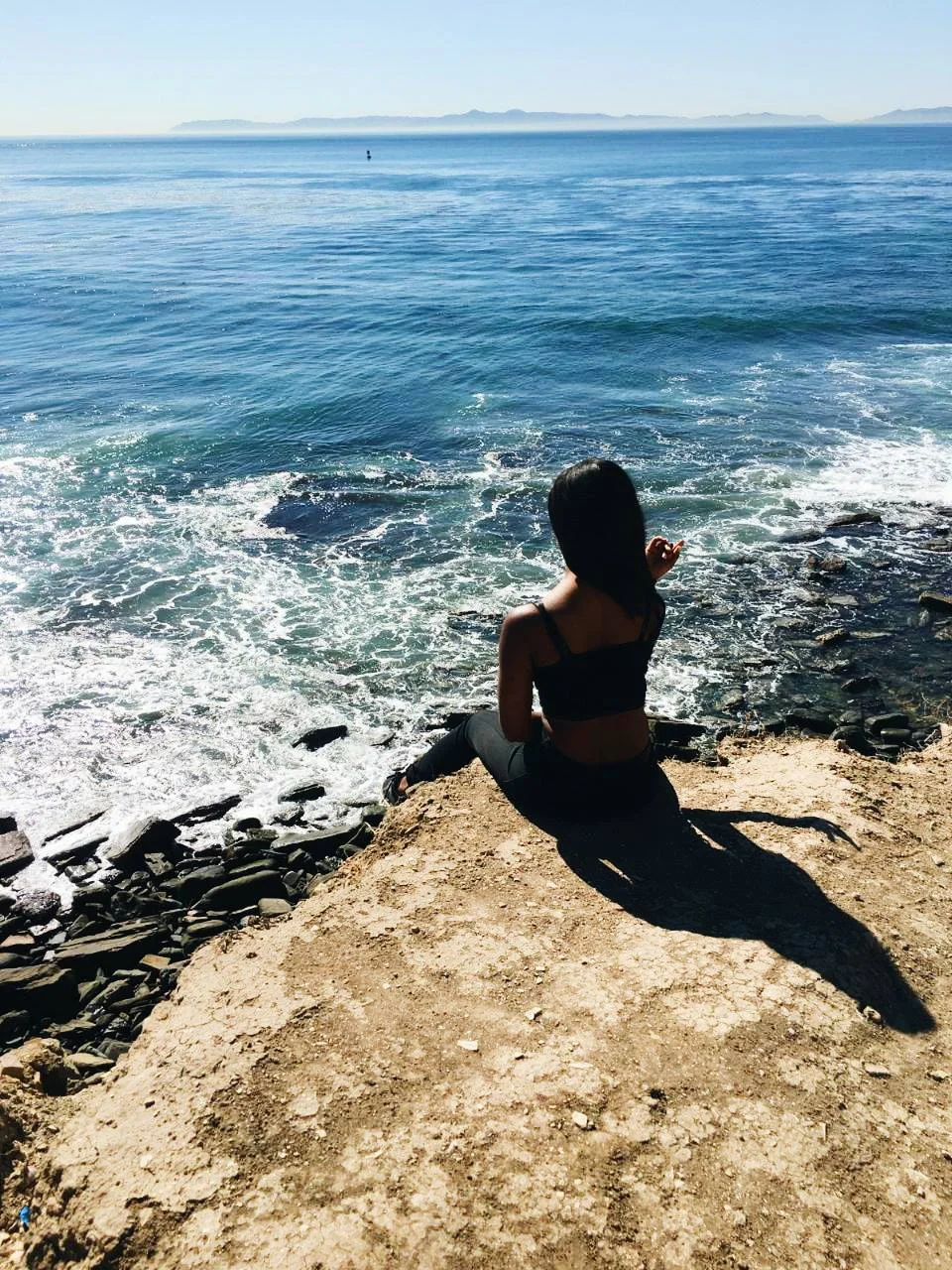 Taken at Sunken City in Palos Verdes, there's no way I'd voluntarily sit on the edge of a cliff if I wasn't trying to take the picture
