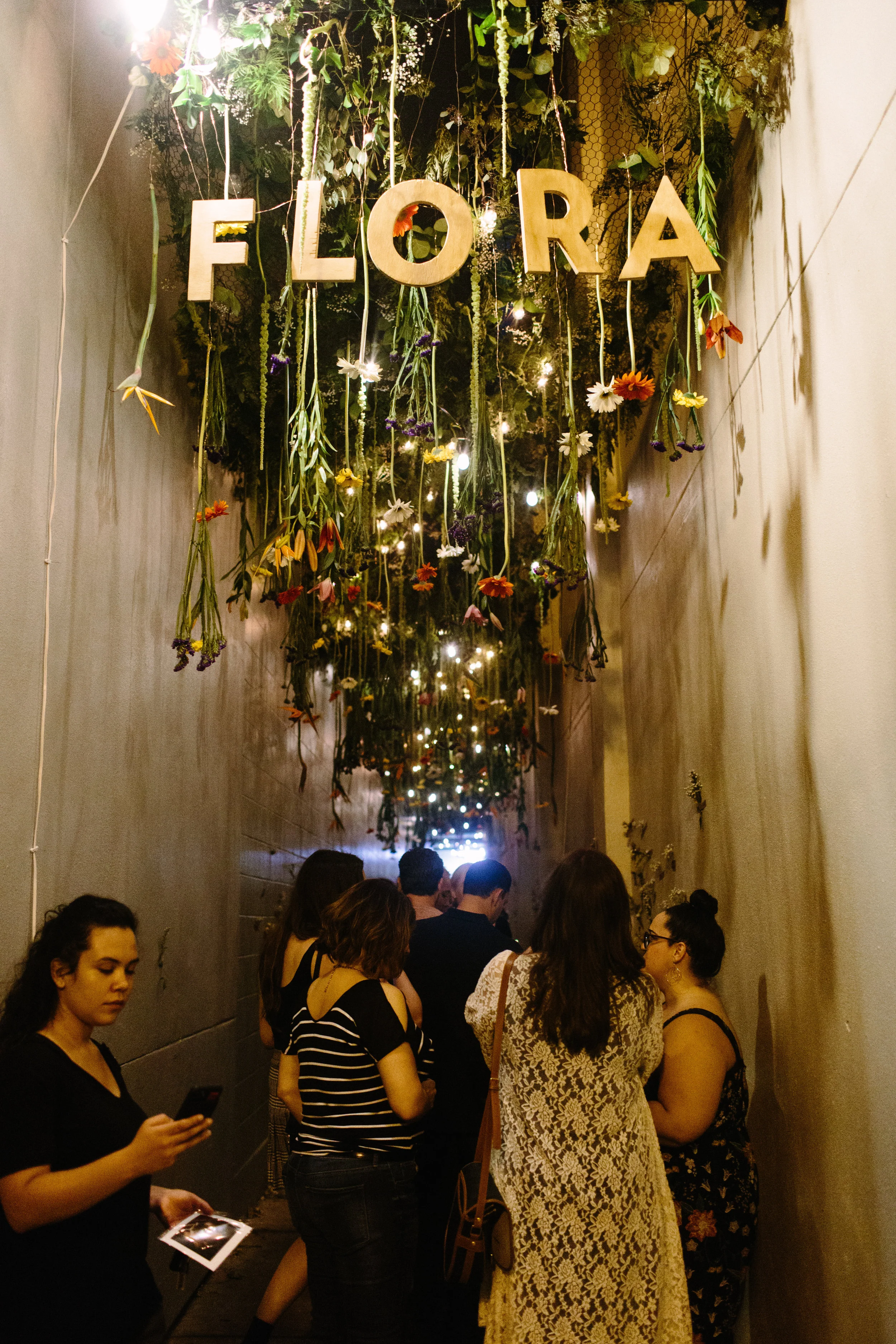 Hundreds of real flowers bring this alleyway to life as part of the Flora installation by Andre Bohrer. (photo : Jesse Walsh)