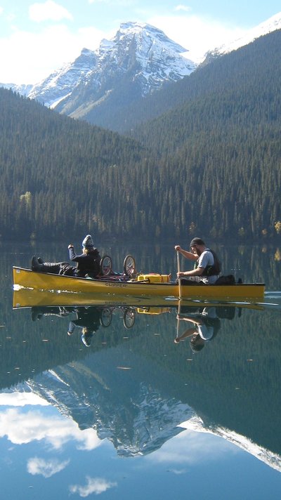 Maddie and Joel paddling through the Bowron Lakes