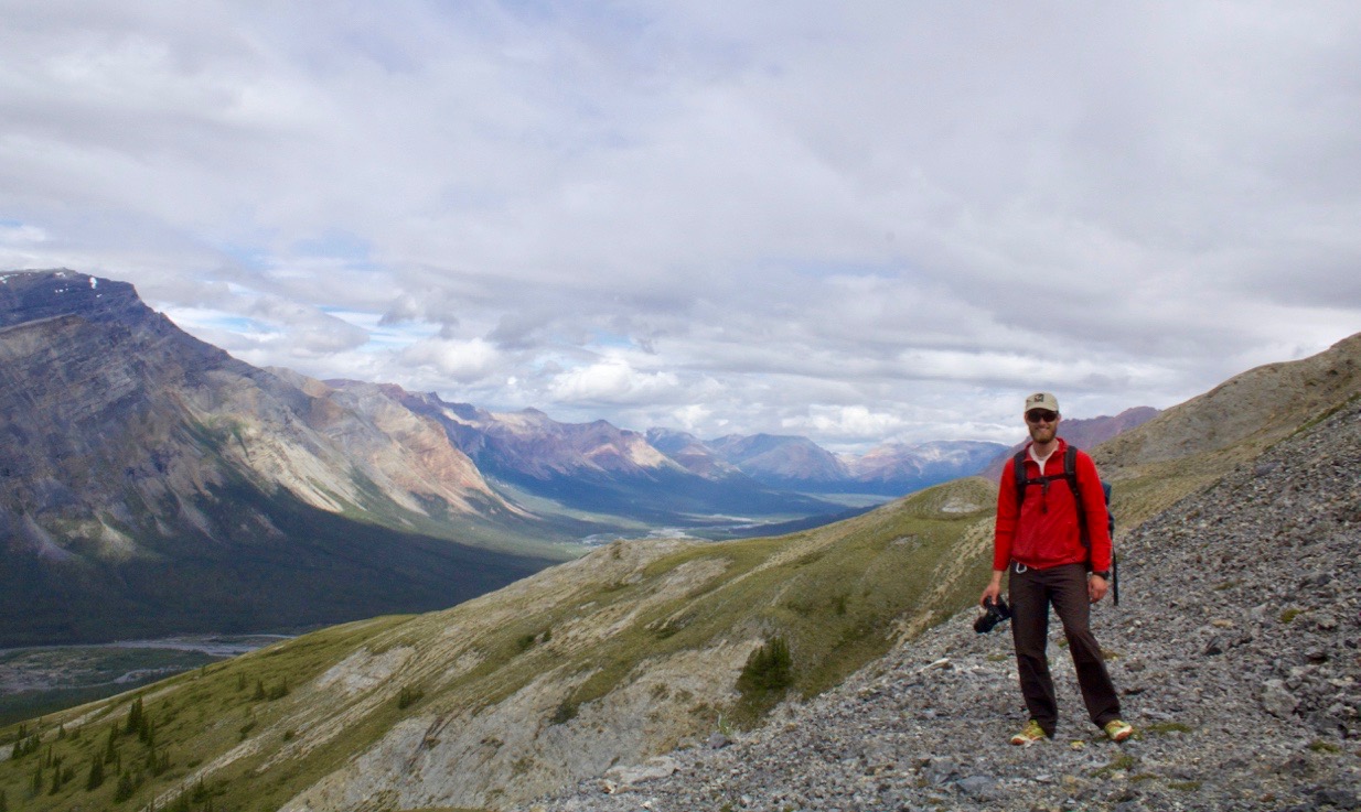 Guide, Liam Ortiz on a slope dotted with grizzly bear den sites. The intact ecosystem of the Mountain River allow us to understand how montane environment once operated up and down the great mountain ranges of the Western Americas.