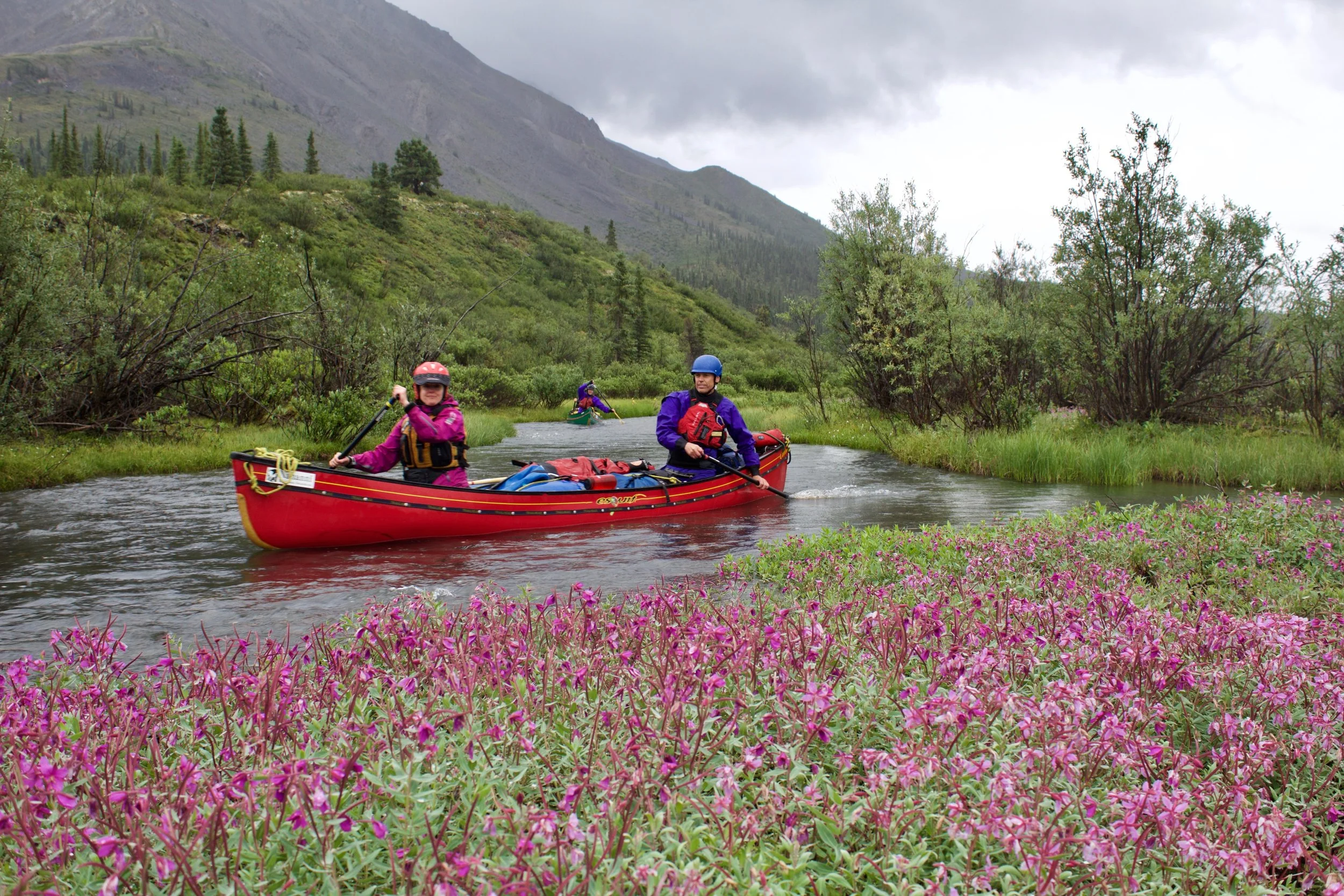 Guests Sherry and Brent getting a feel for their Esquif Canyon in the head waters of the Mountain River.