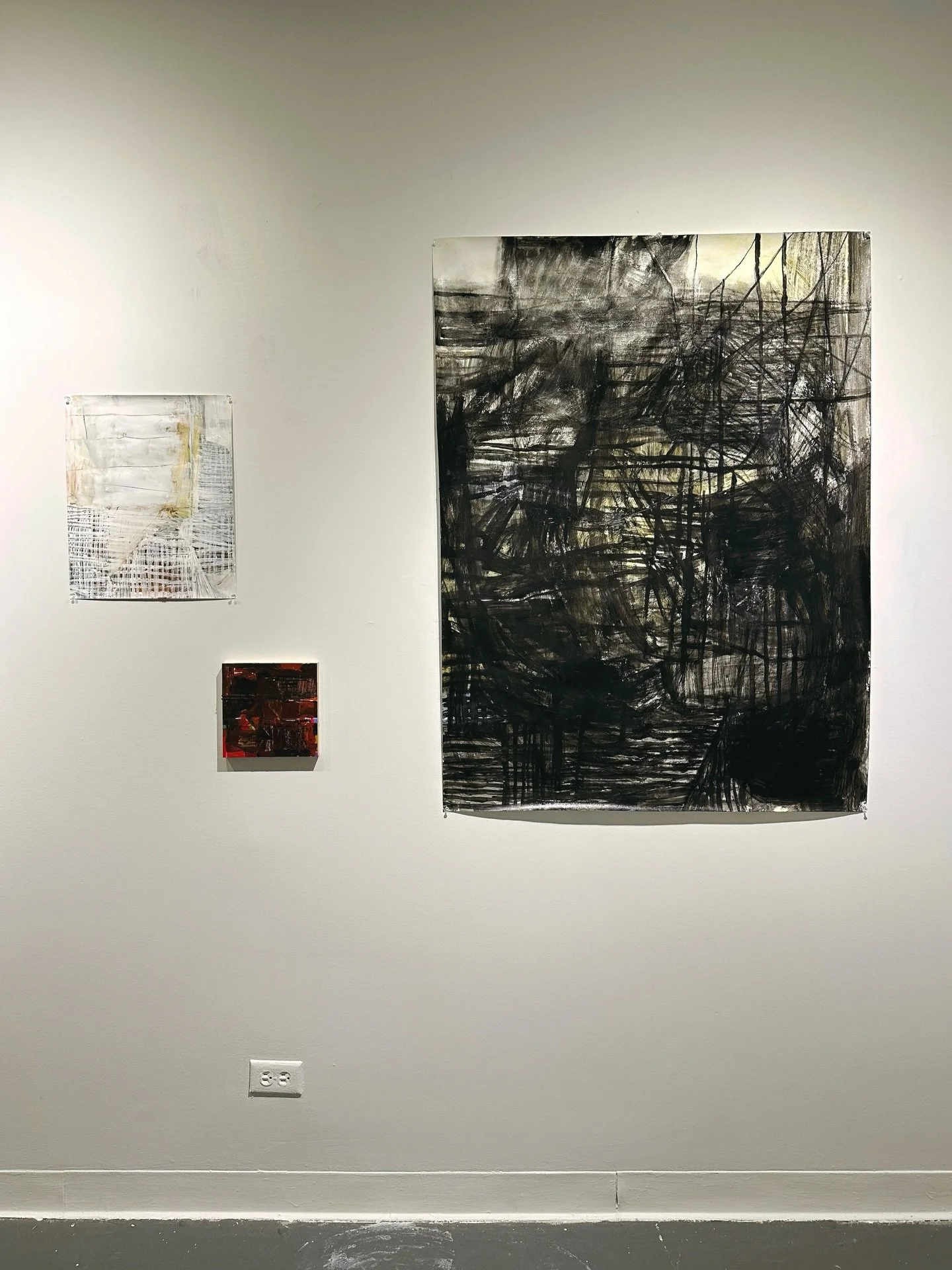 This was my absolute favorite section of all the walls 🥰 It has the large black next to the small white piece. And then that little red one 🎈 That red painting is everything. I remember when we put that mini red square there, it was like the whole 