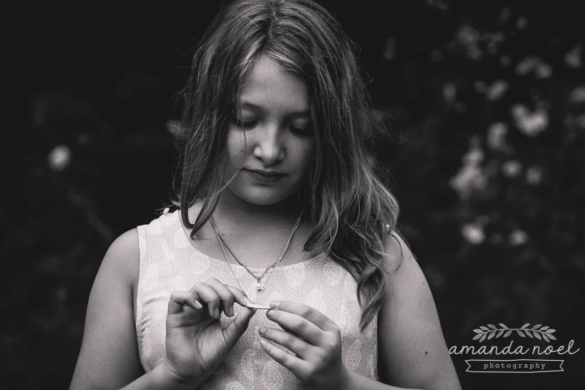 girl-black-and-white-portrait-natural-looking-down