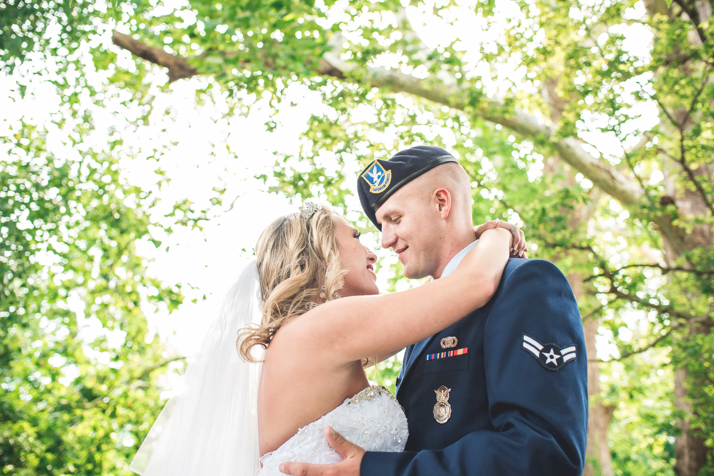 Columbus Ohio wedding photographer bride and groom embrace in the trees